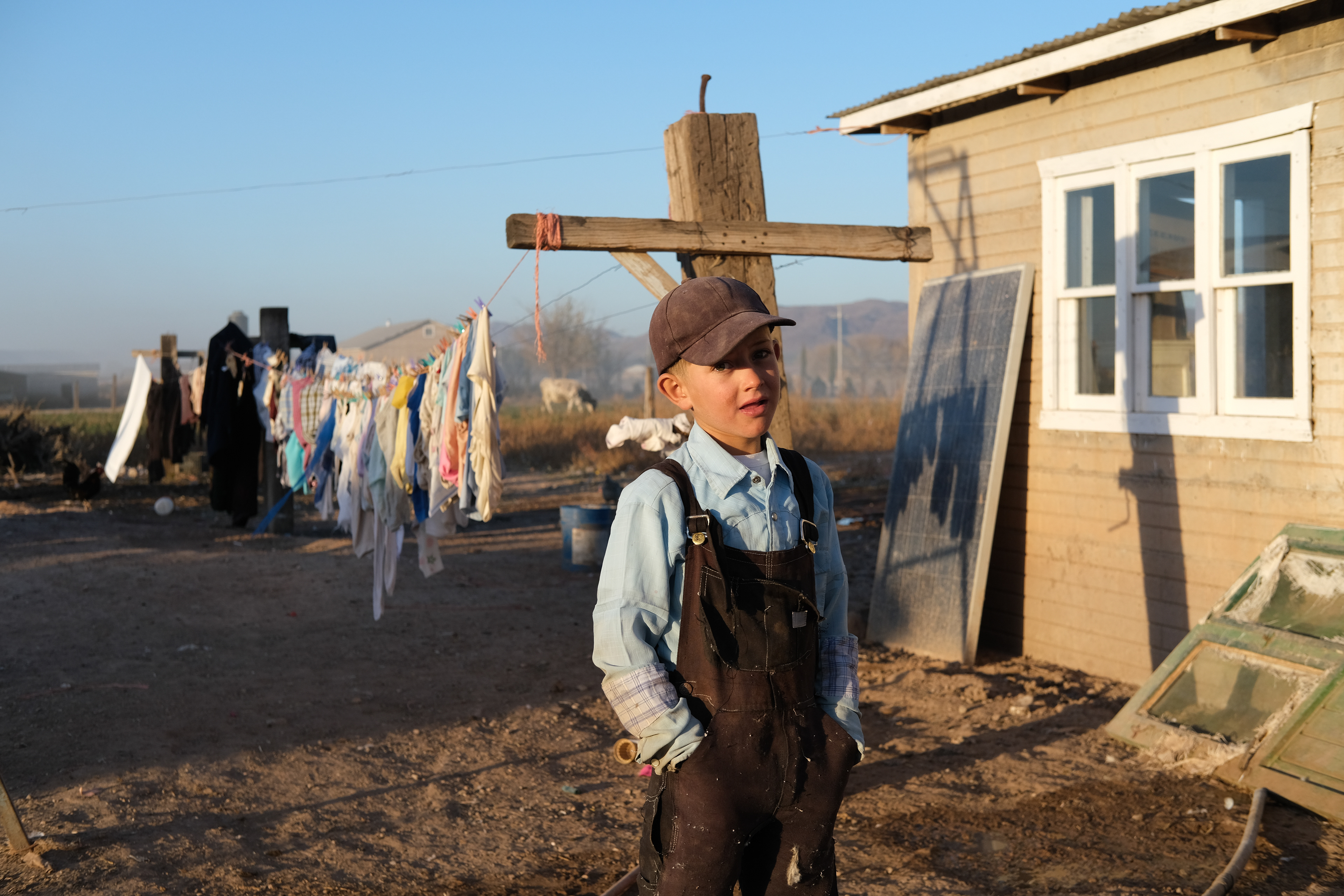 A mennonite boy outside his home. Sabinal, Chihuahua