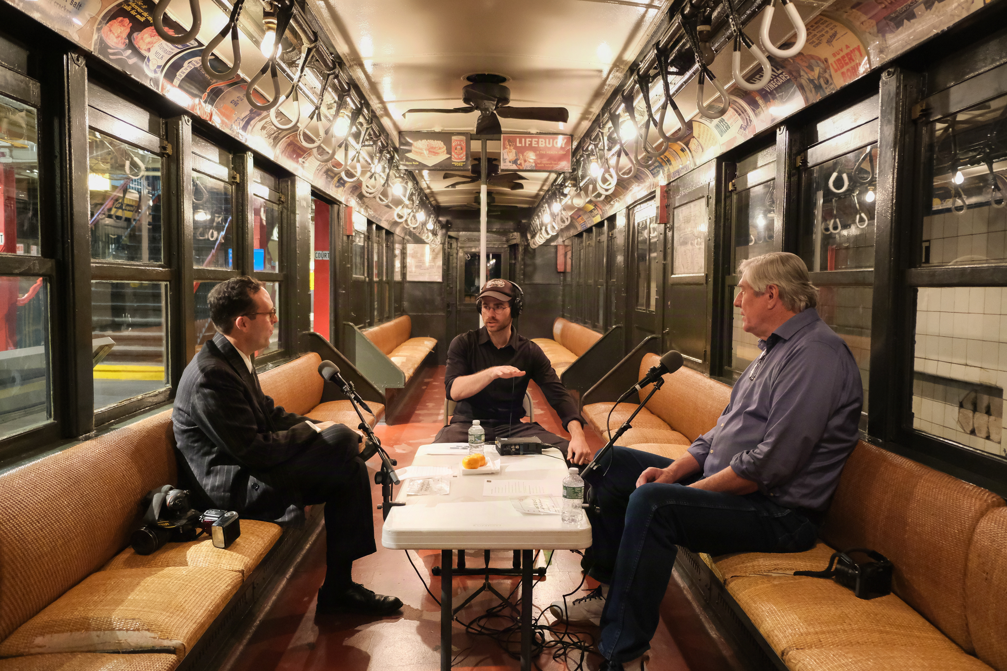 Facilitator Jonathan Zelinger (center) preps MTA photographers Marc Hermann (left) and Patrick Cashin (right) for their recording.