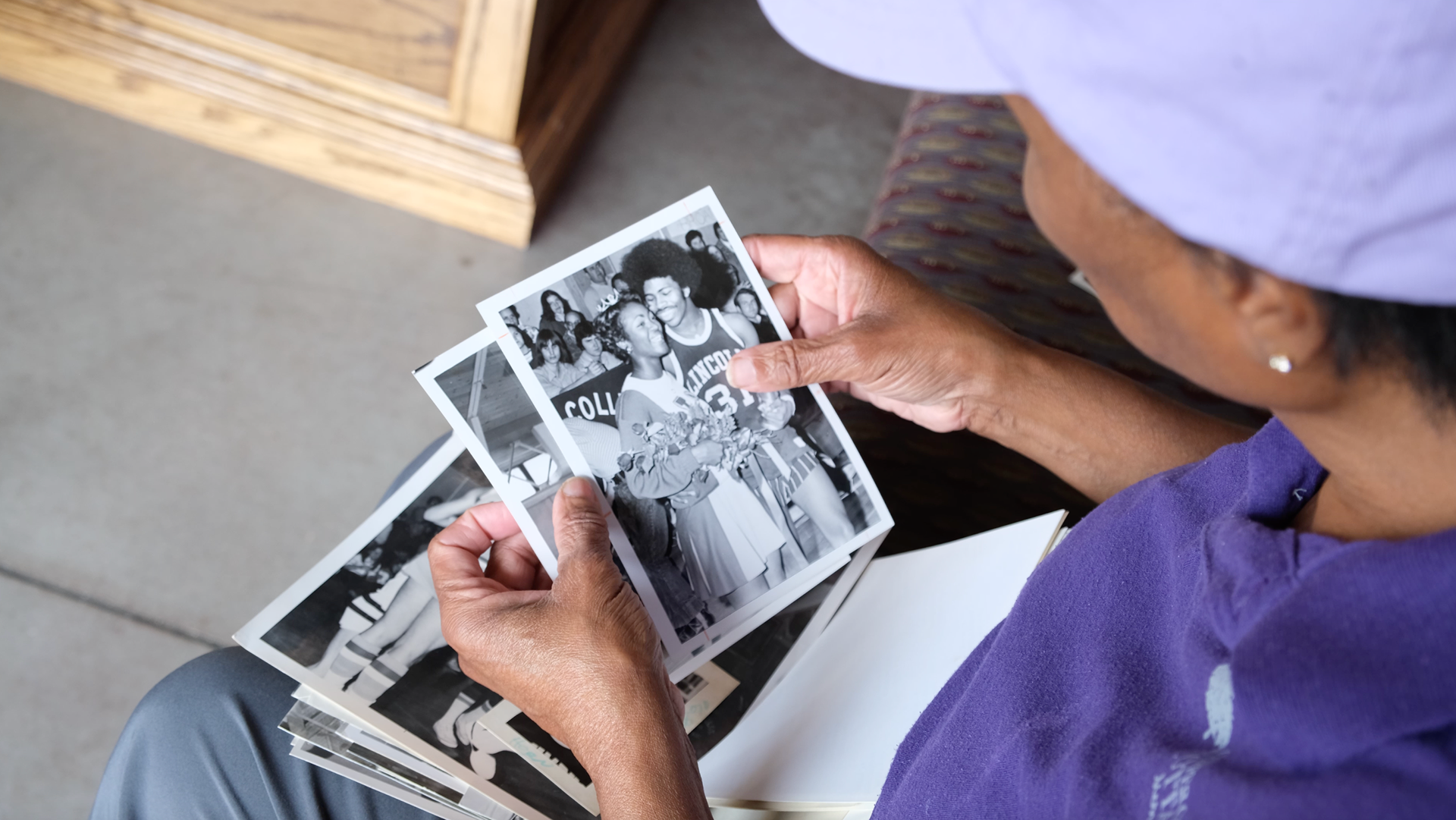 Lincoln local and College Alum Ms. Linda looks through archival images of Lincoln College.