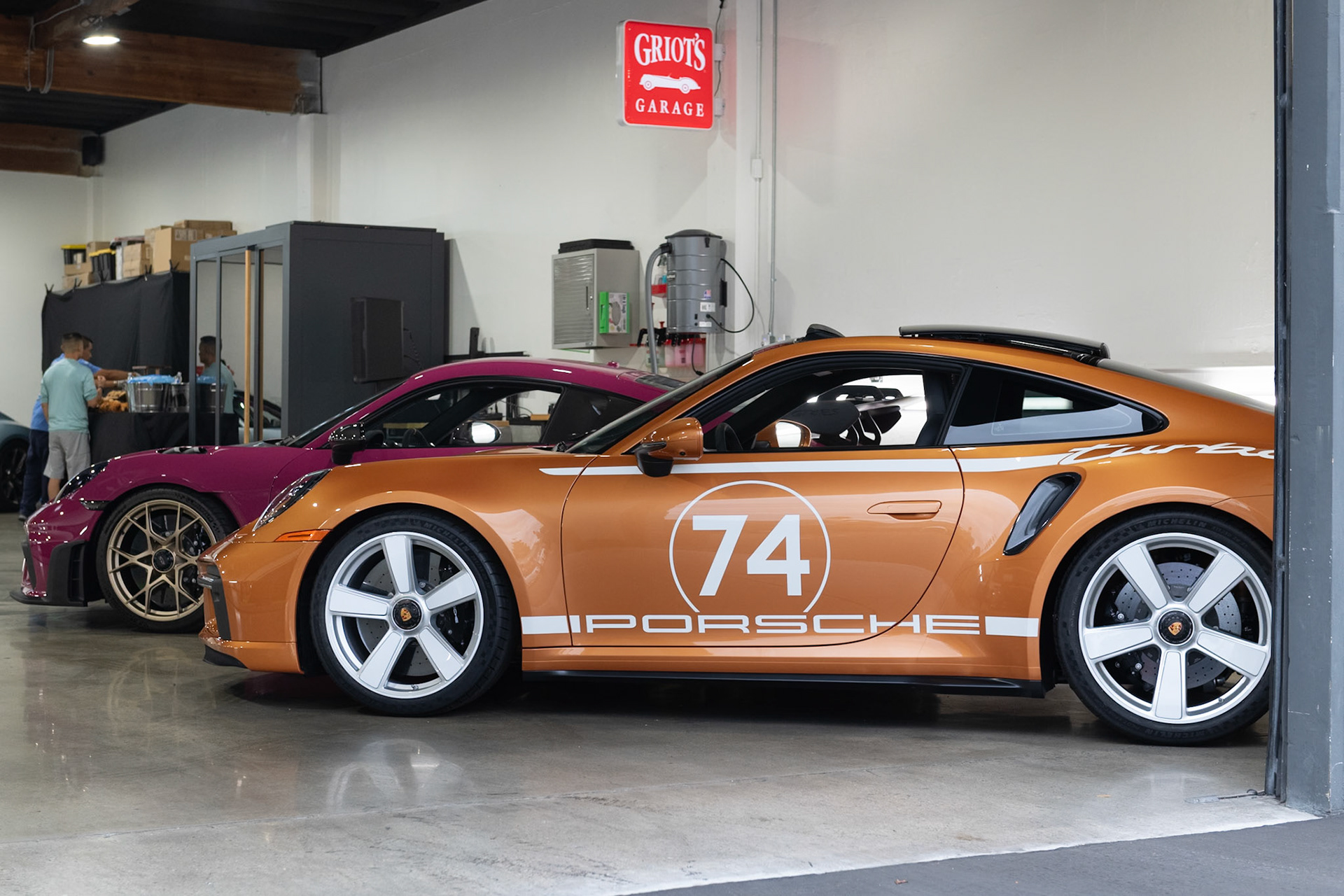Porsche 911 Turbo in Nordic Gold, Porsche Cayman GT4RS in Rubystar