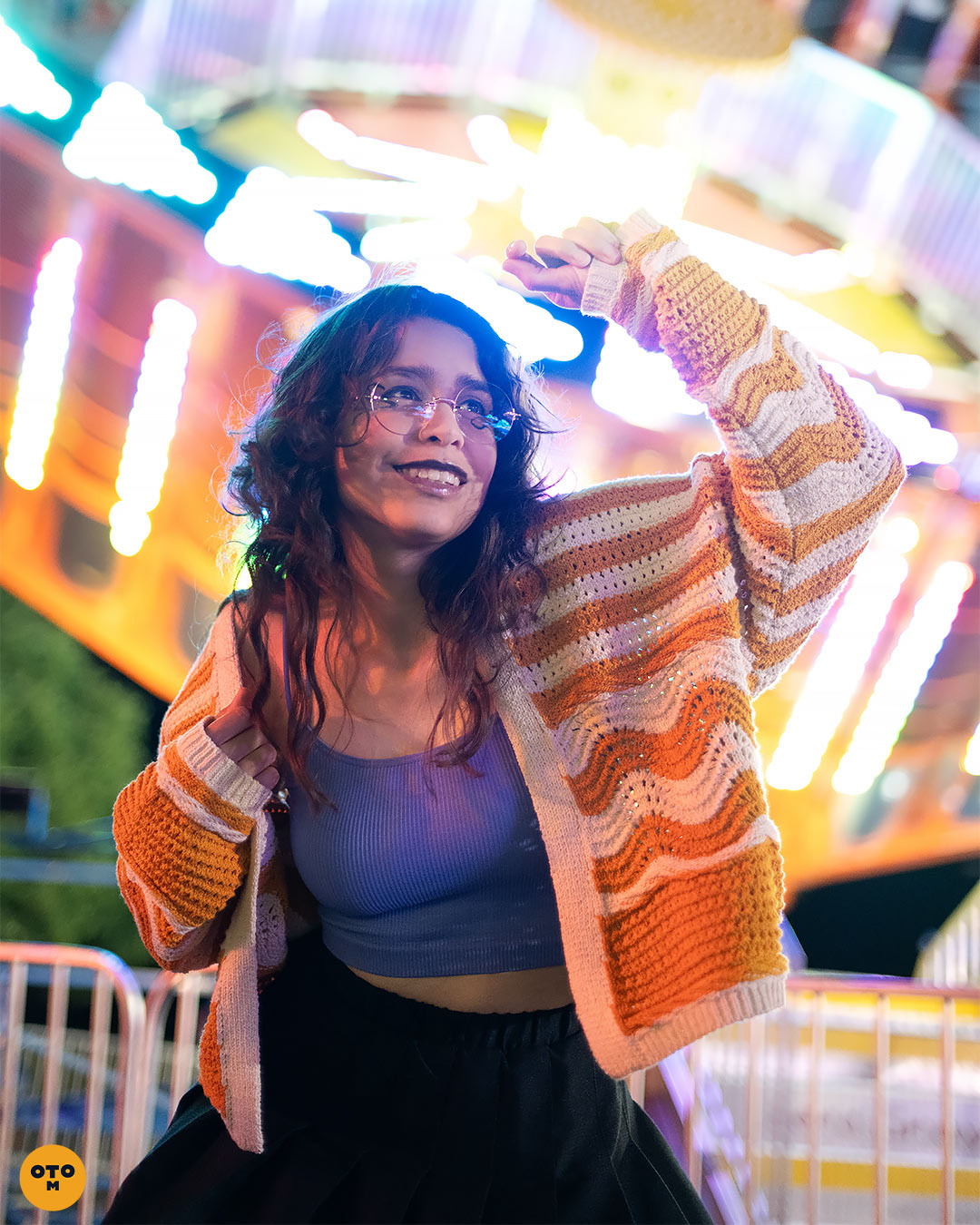 colorful neon lights, carnival photoshoot with girl standing in front of UFO ride, photo series by otrominuto creative photography. Shot on Nikon Z7 mirrorless
