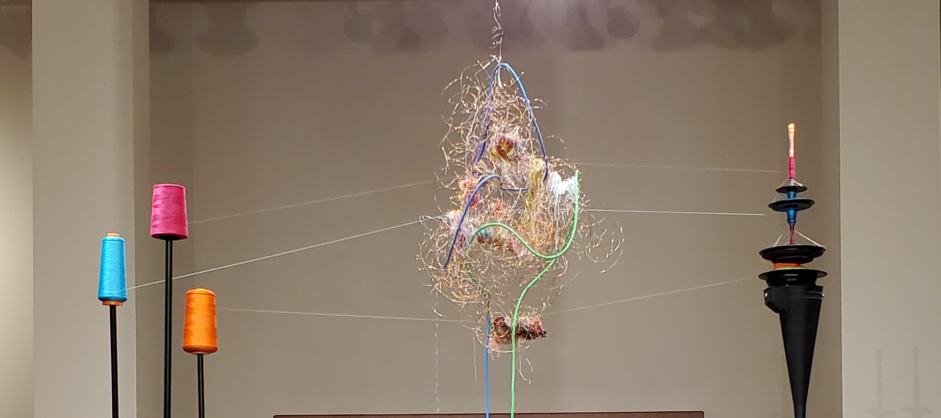 Closeup of thread spools, Neural KNot, and winder.