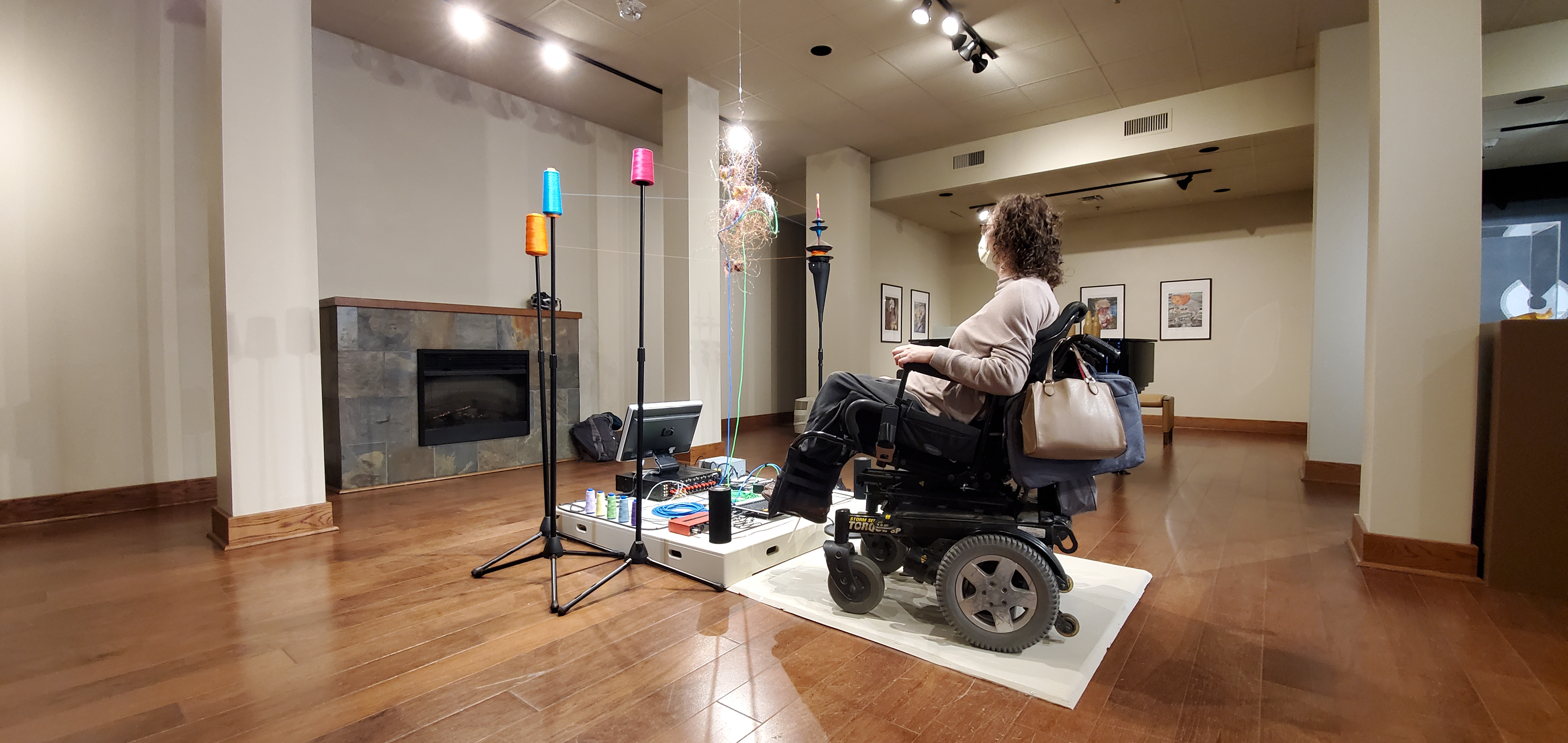 Neural KNot: Syncopated/Synaptic/Syncope 2021. viewer engaging with tactile sound platform side view. Viewer Yvette Cenerini