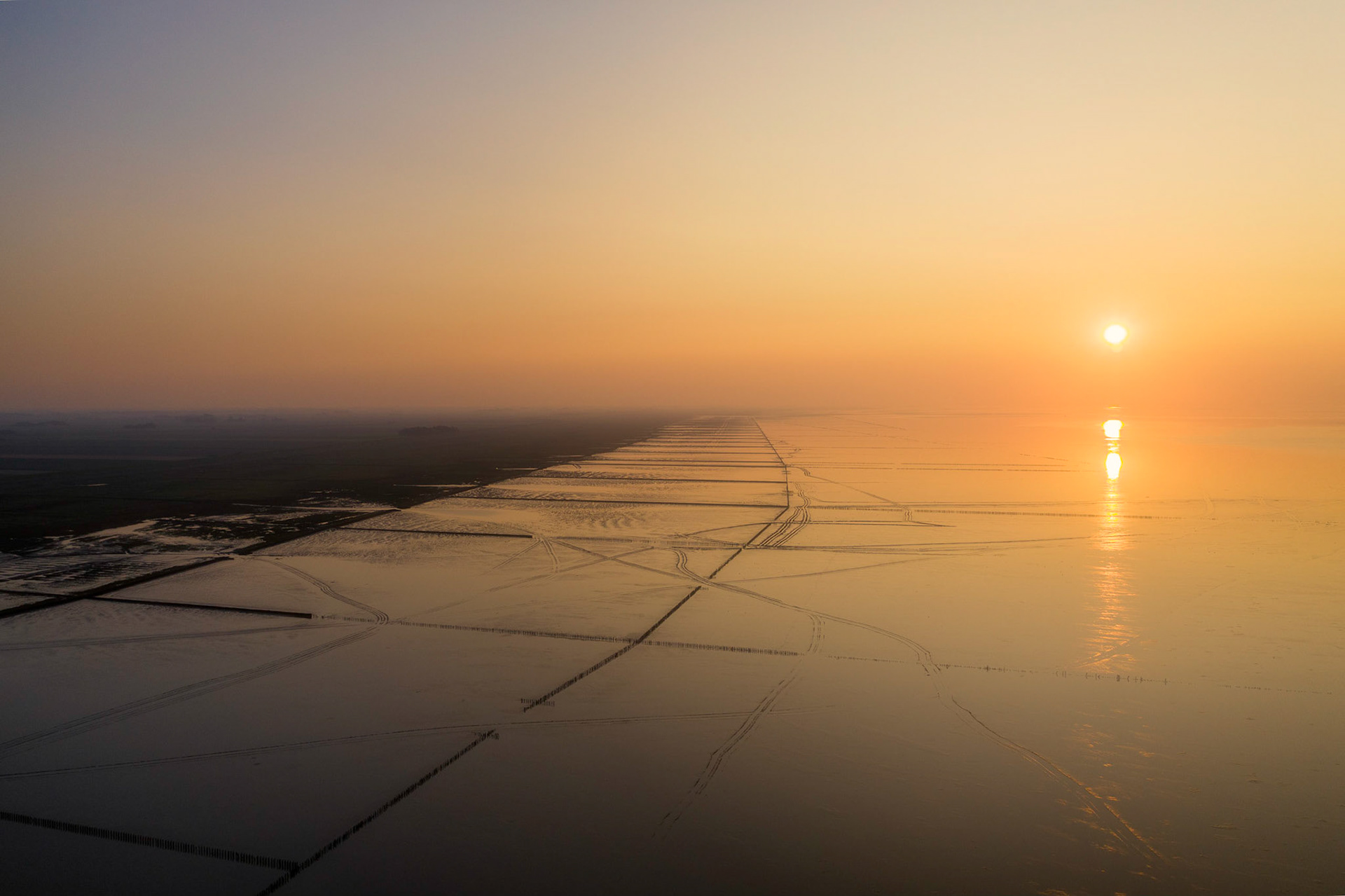 A hazy sunset over the Wadden Sea.