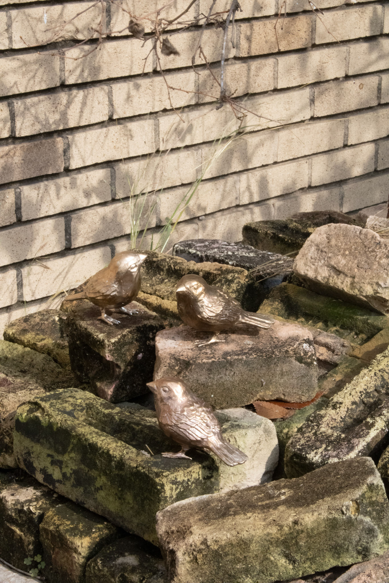 Sparrows, 2022, bronze and found debris.