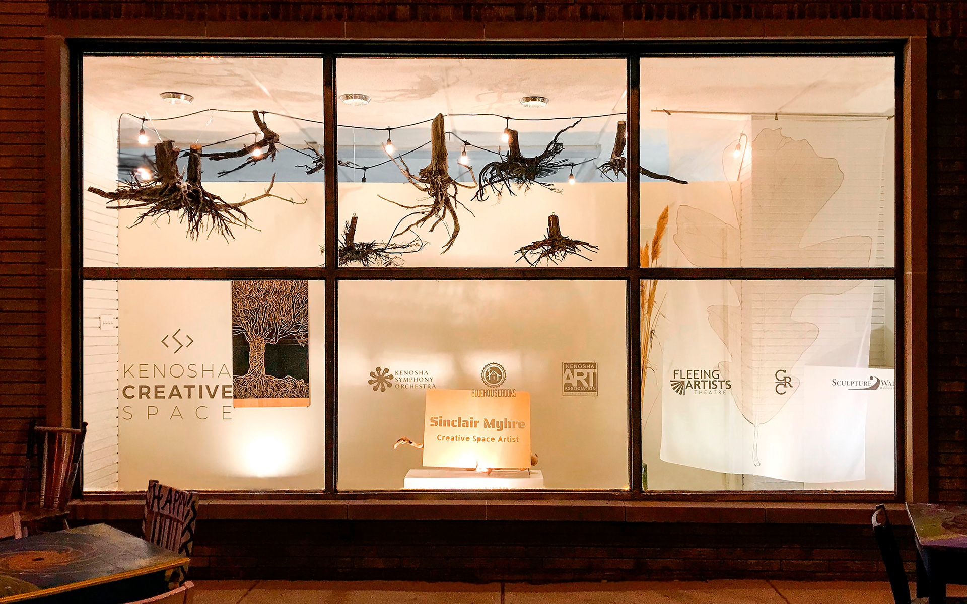 Kenosha Creative Space night Window Display 8 hanging tree roots