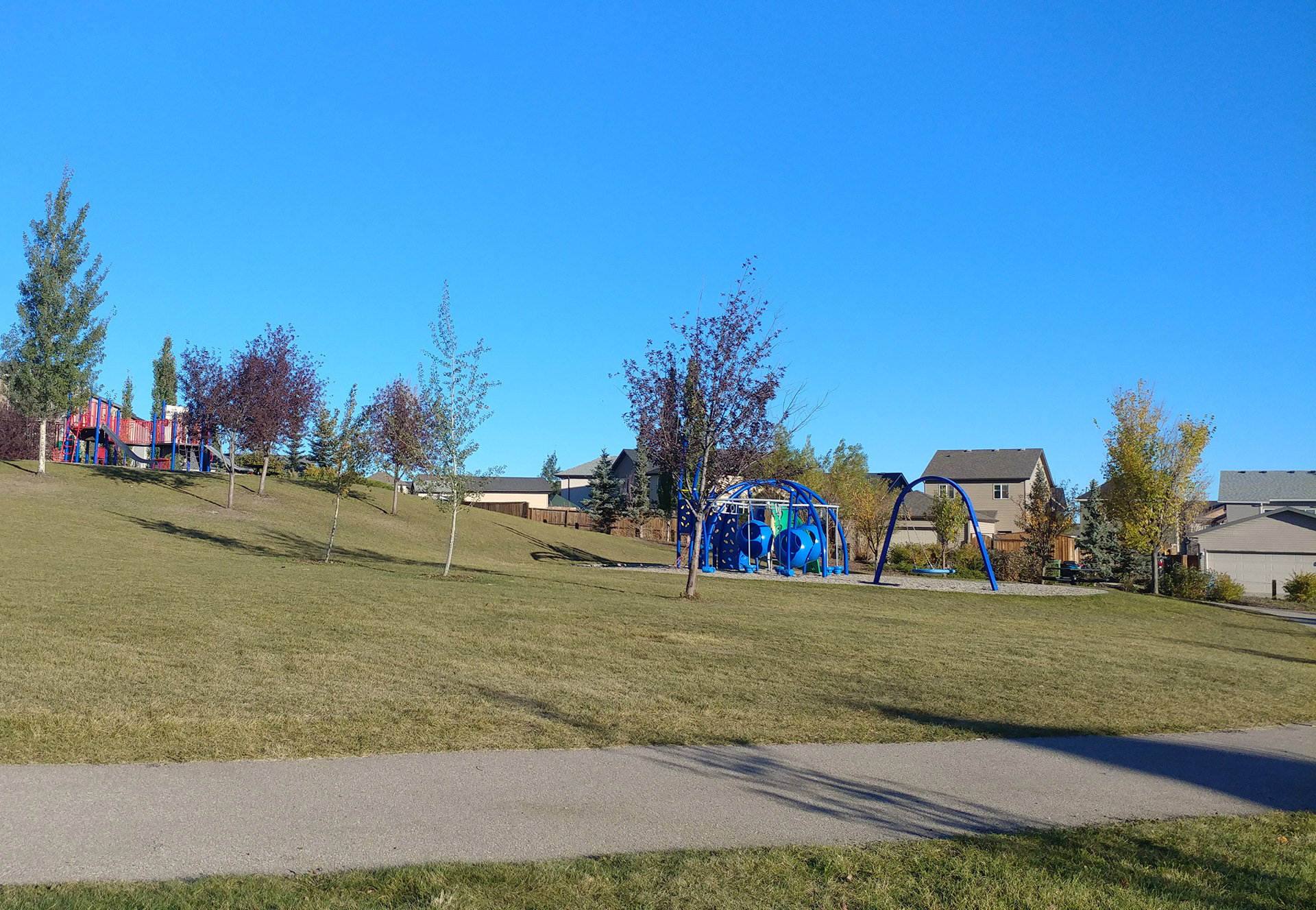 One of the many playgrounds with manicured grass.