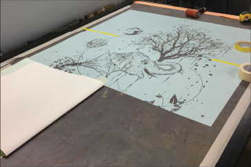 stencil segmented into fabrication panels to accommodate material width constraints.