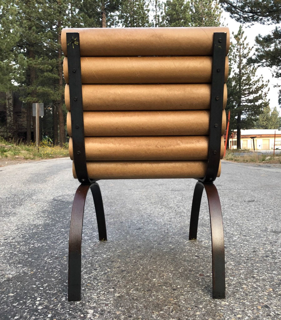 20” long cardboard tubes fastened with black iron nuts & bolts to 3/8” bent steel frame