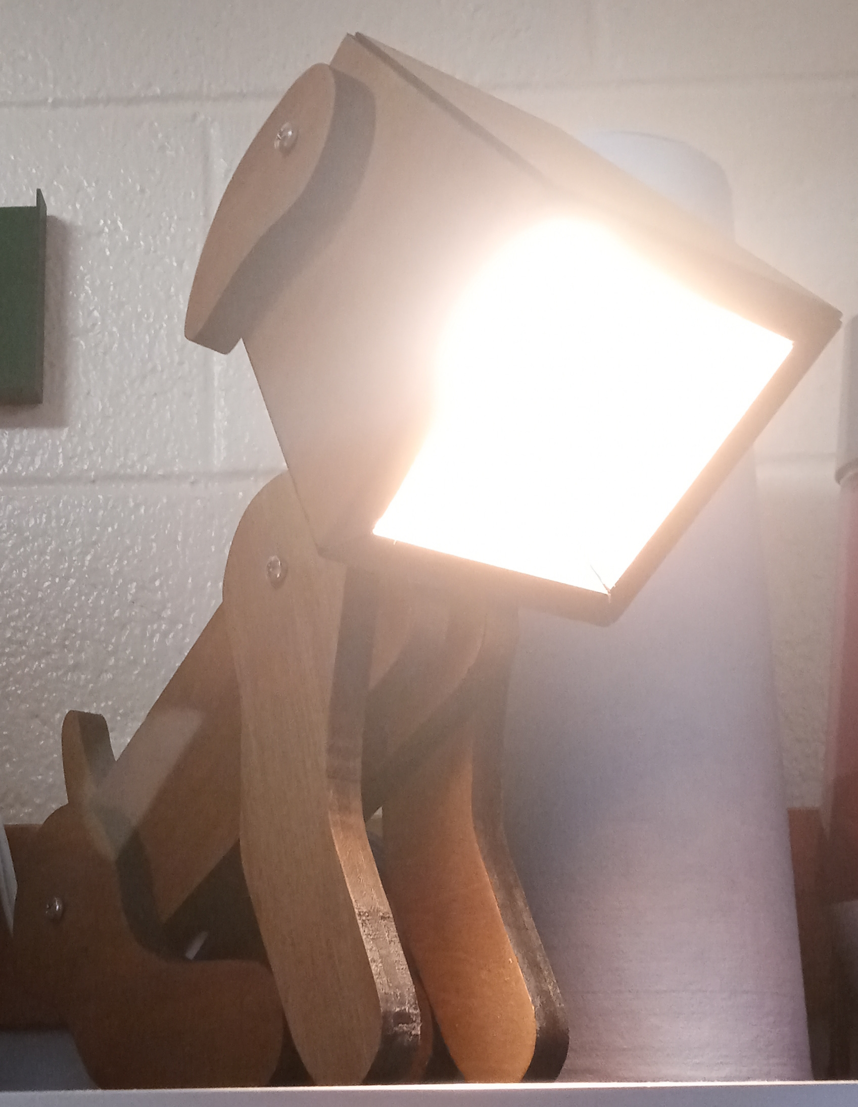 Dog lamp looking down, lit up