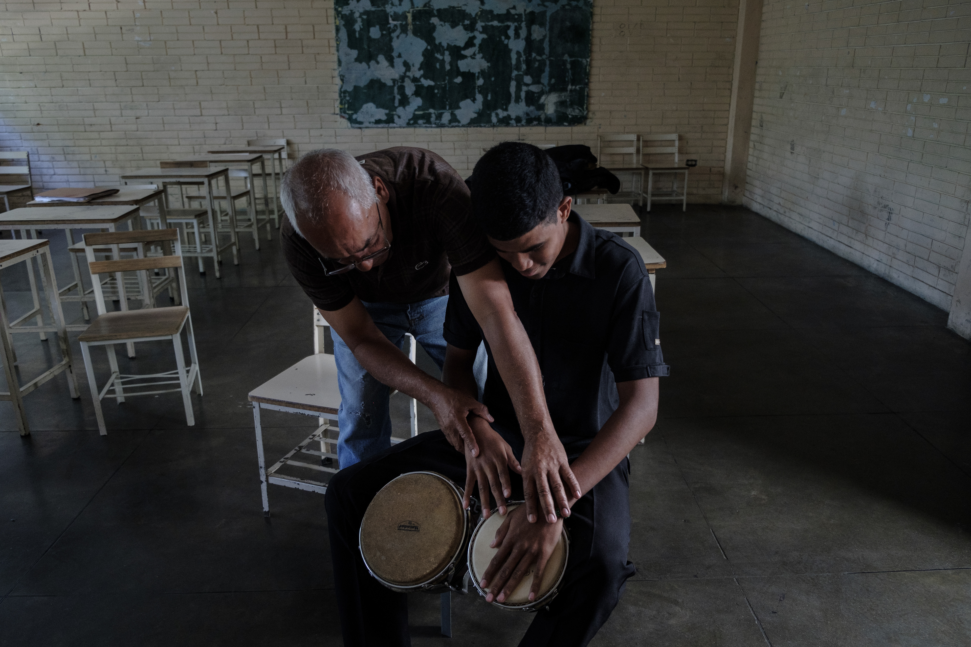 Cherart Rodriguez learning how to play the bongos. Caracas, April 6, 2019