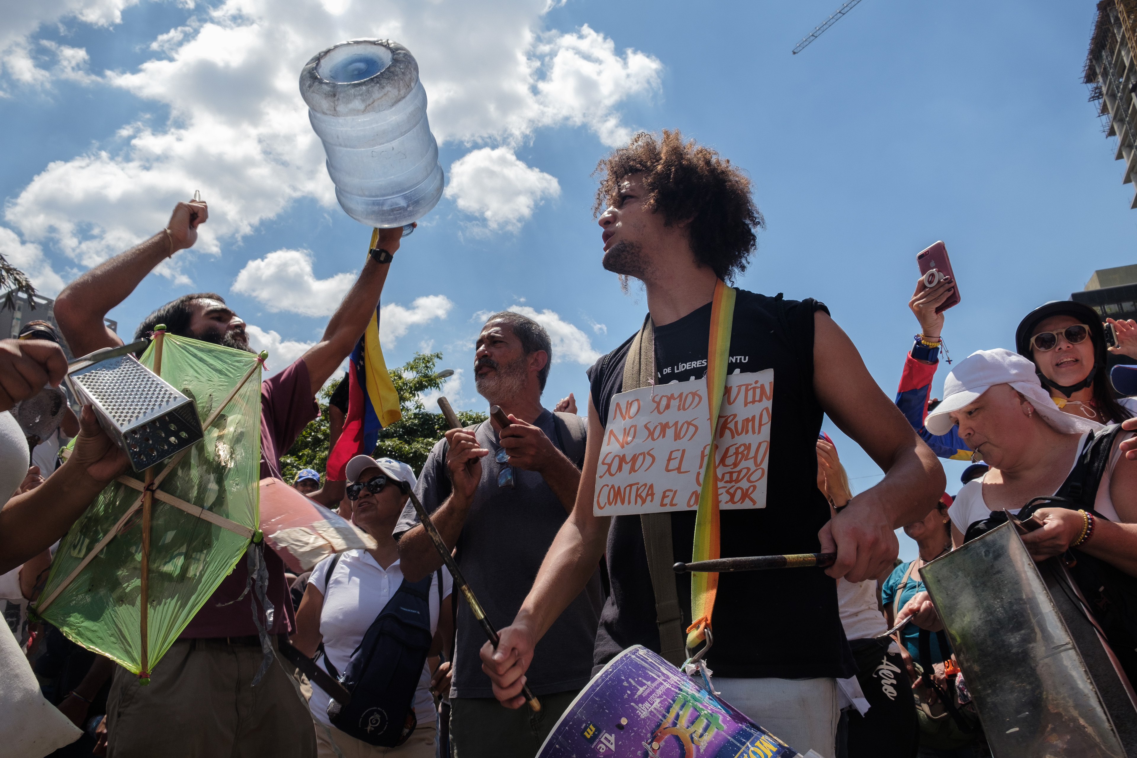 Marcos Salazar, musician, actor, professor and theater director at an anti government protest against the lack of water and electricity. Other musicians joined him with improvised instruments like a grinder, a water bottle and a metal cabinet. Caracas April 6, 2019