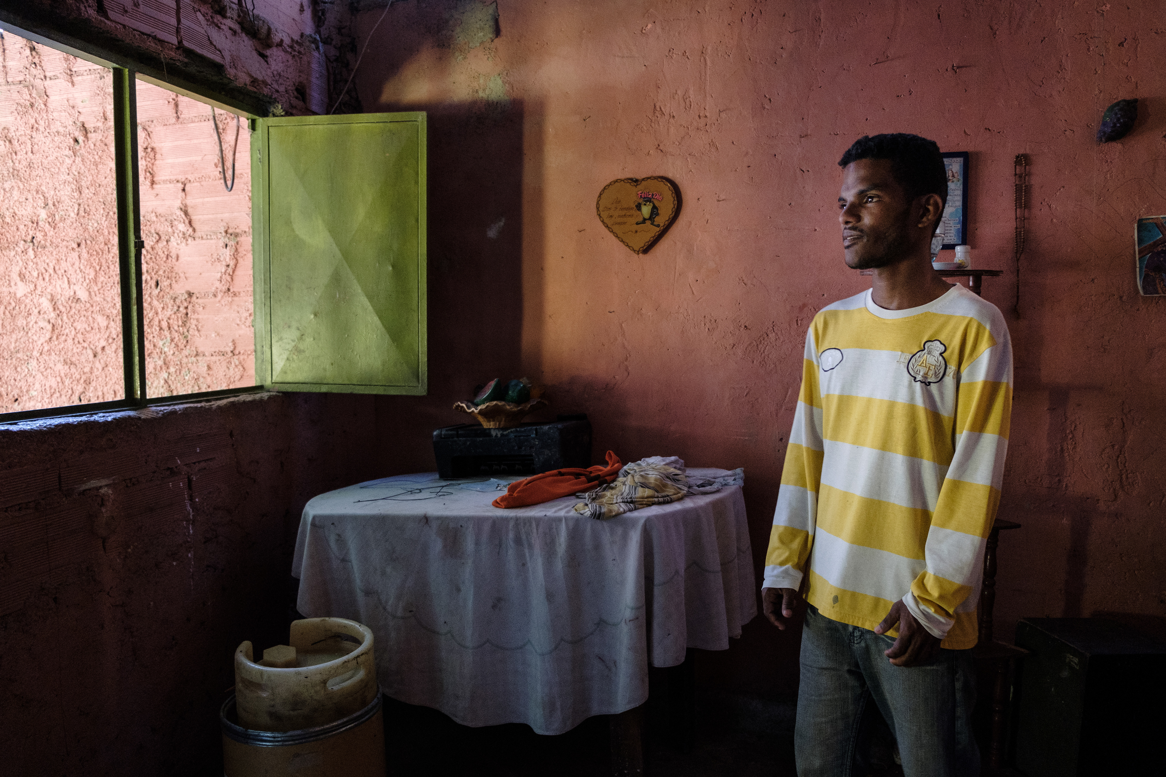 Duglas Alexander Mendoza, poses for a portrait in his house in San Isidro, Petare. This Neighborhood is one of the poorest and most dangerous areas of Caracas. April 5, 2019