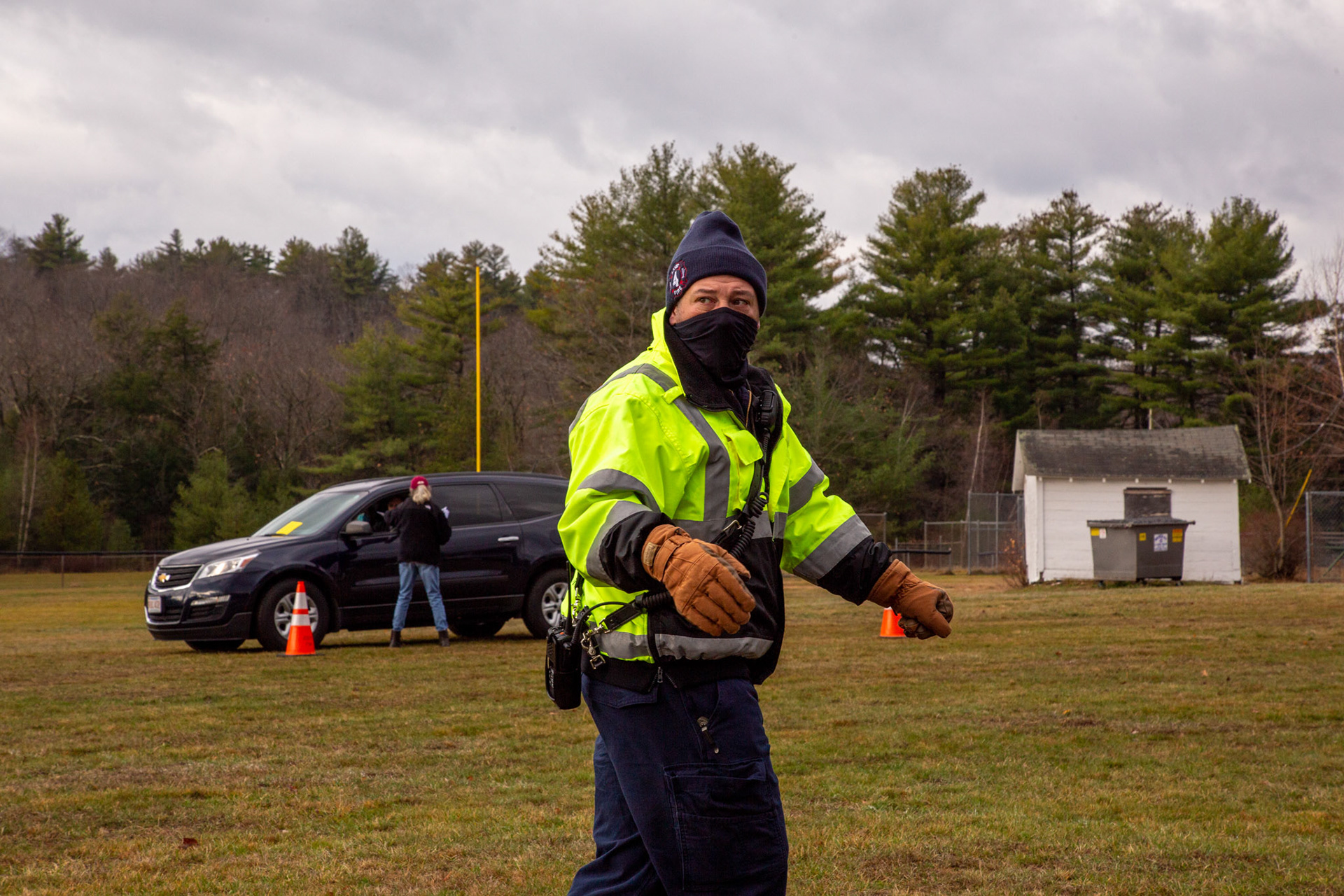 A police officer directs traffic for a small town election. November 2020, Ashby, MA