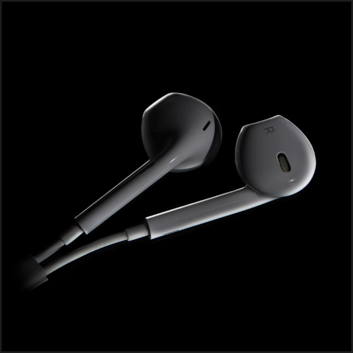 iPhone earphones. Practice studio setup. Single light. Nikon D5200.