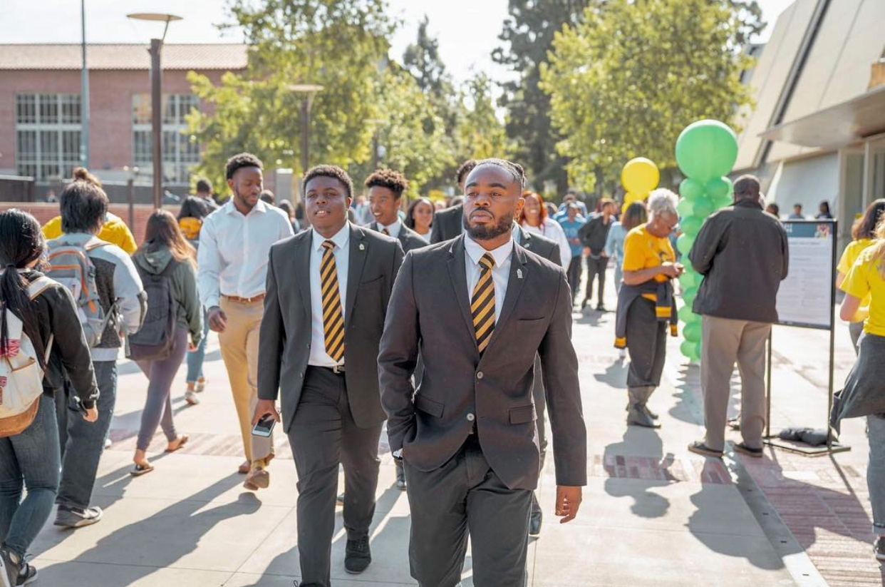 Brother Akinrimisi and Jones leaving Pauley Pavilion after stepping for Michelle Obama and the 2019 National College Signing Day at UCLA.