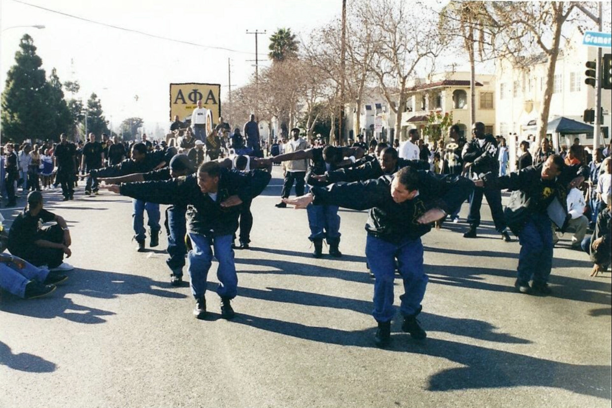 Gamma Xi stepping during a parade