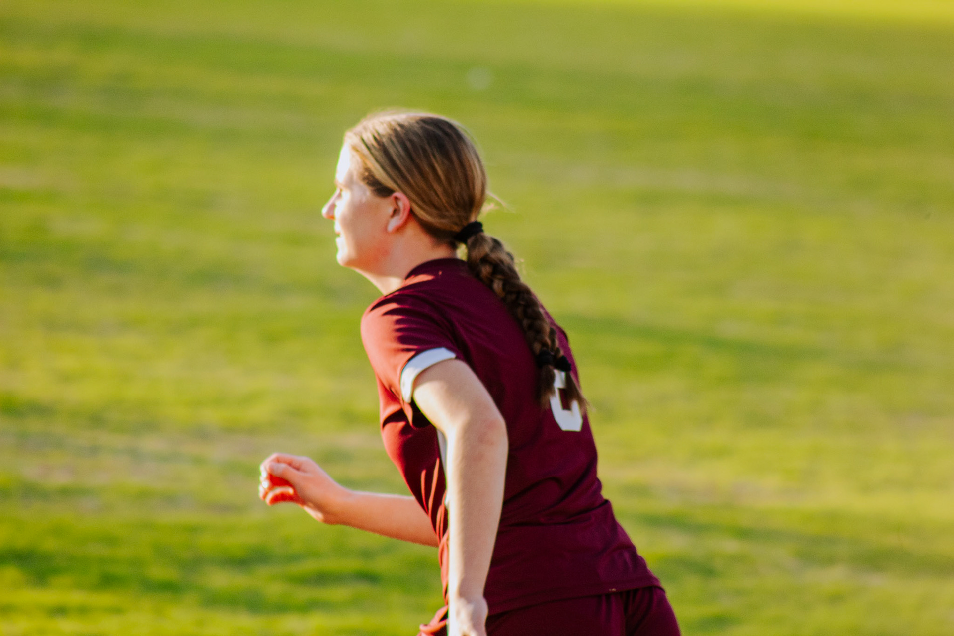 #6 Kacee Esco running on the soccer field during a match aganist Pelion