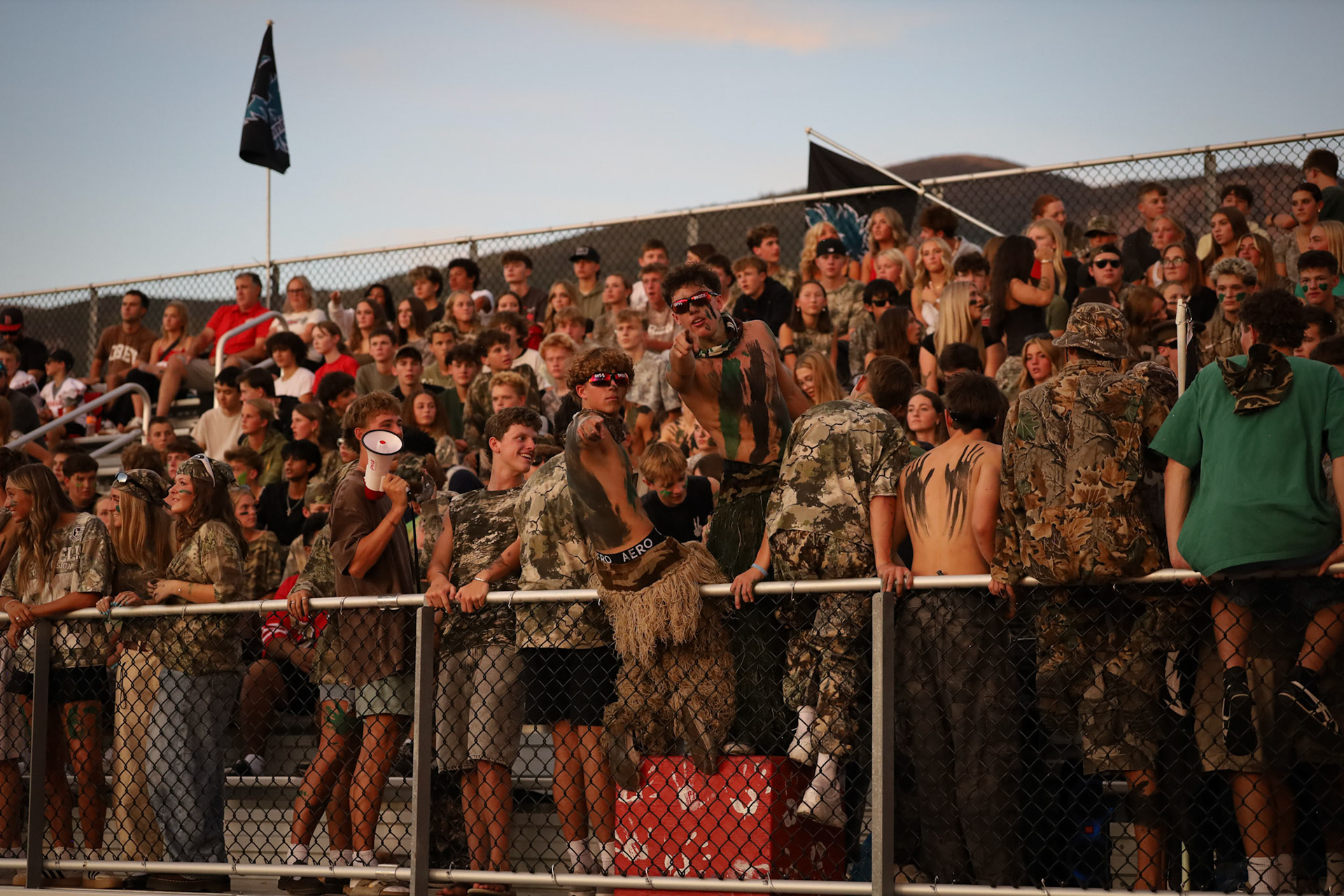 Visiting student section cheers on Bountiful Redhawks as Bountiful heads into halftime leading 5-3 over Farmington.