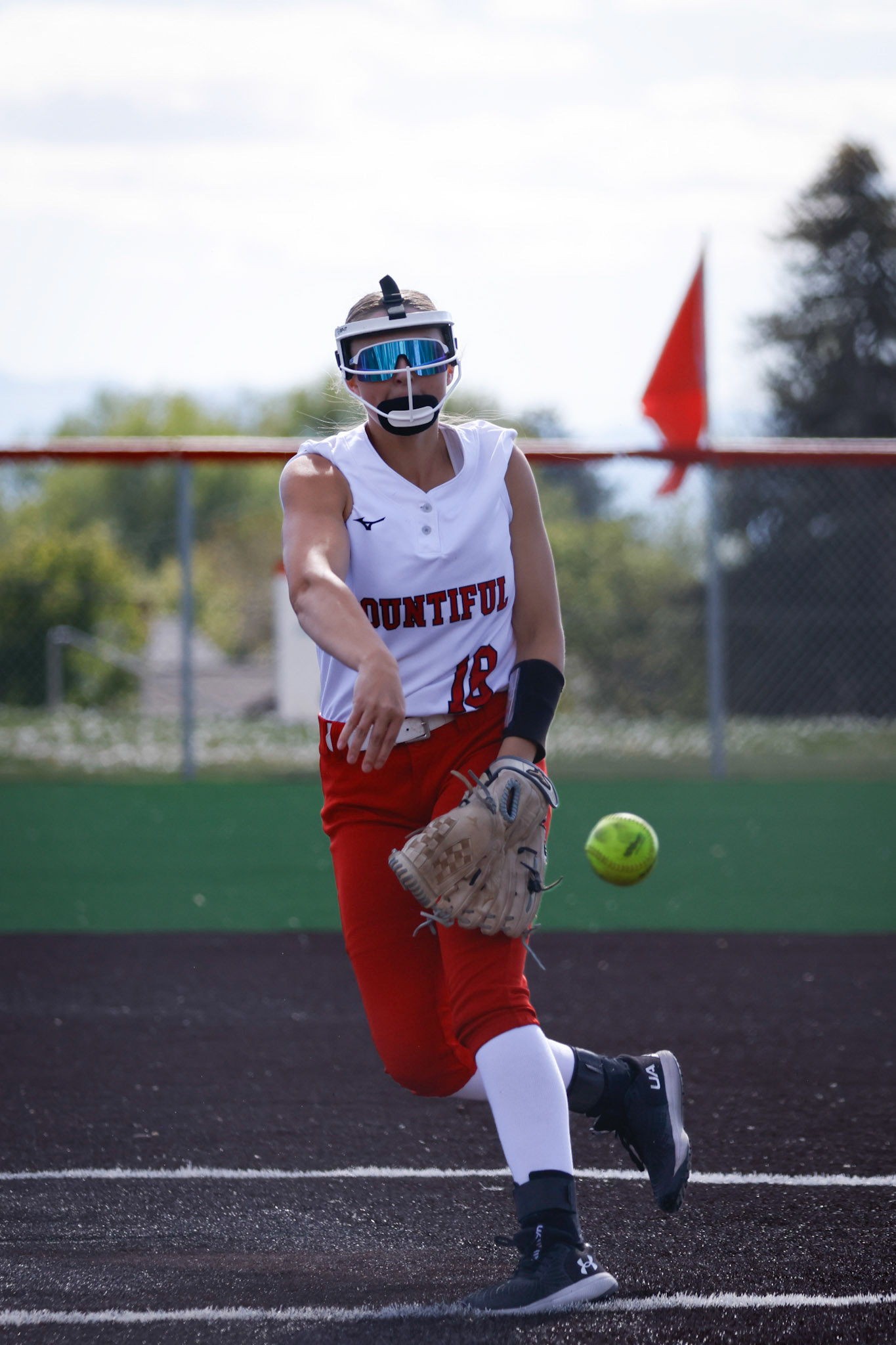 Bountiful Pitcher Dylan Carpenter (18) sends a pitch over homeplate to start the fourth inning as Bountiful clings to 3-2 lead over Woods Cross