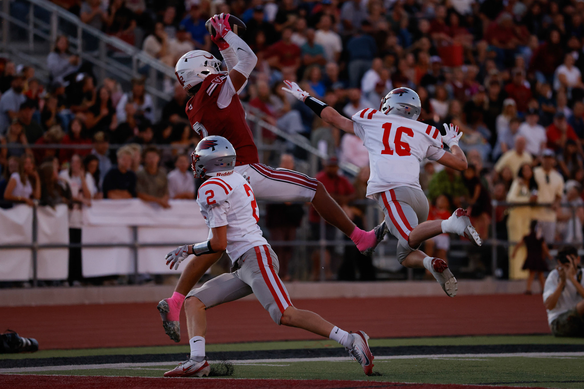 Viewmont WR Jayson Dunroe (2) makes a touchdown catch over Bountiful defenders Tyce Budge (2) and Mason Tidwell (16) to put the Vikings up 7-0 in the first quarter.