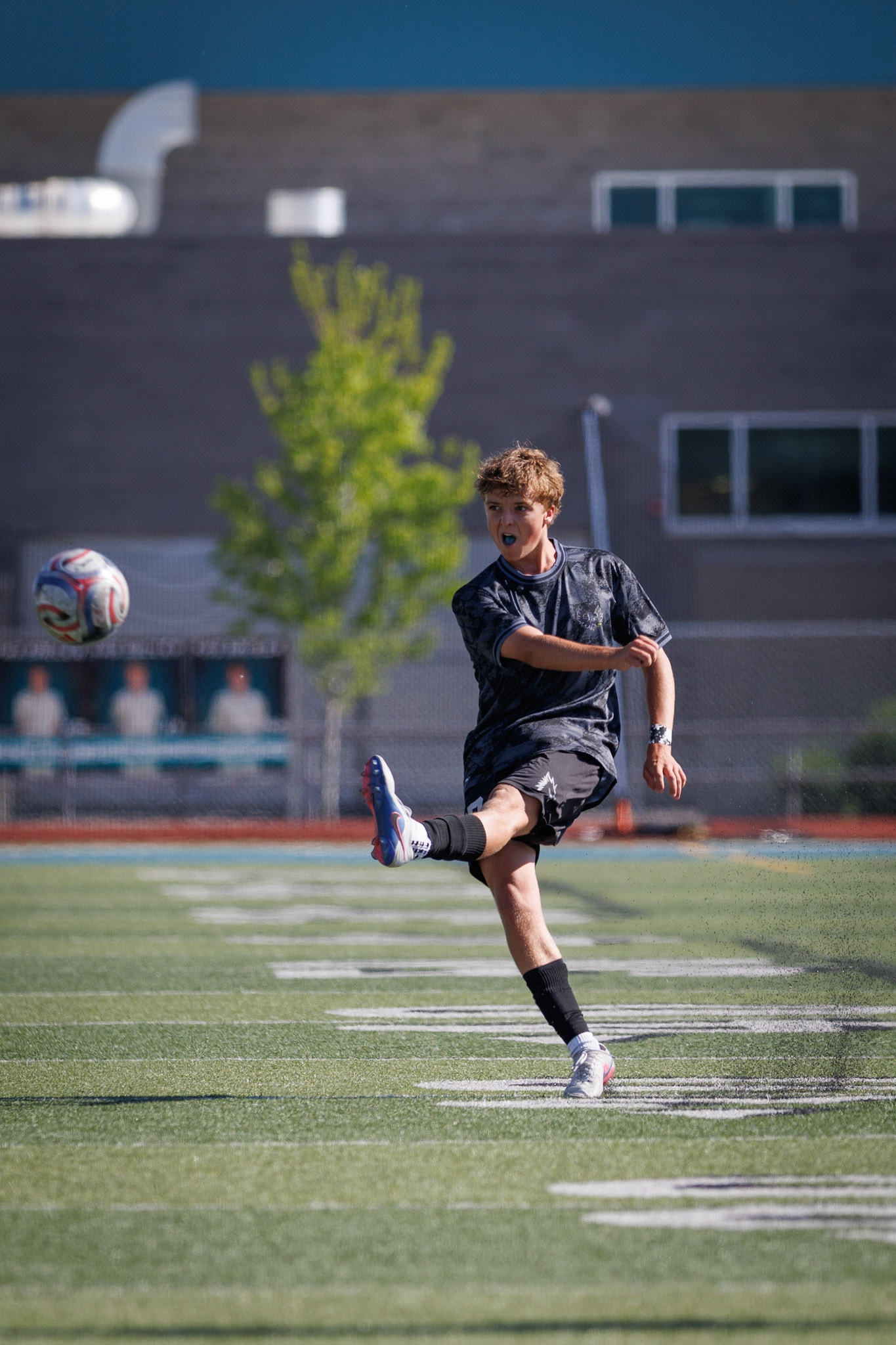 Farmington's Drake Arnold (8) crosses the ball as Farmington looks to hold onto their 1-0 lead early in the second half of play against American Fork.