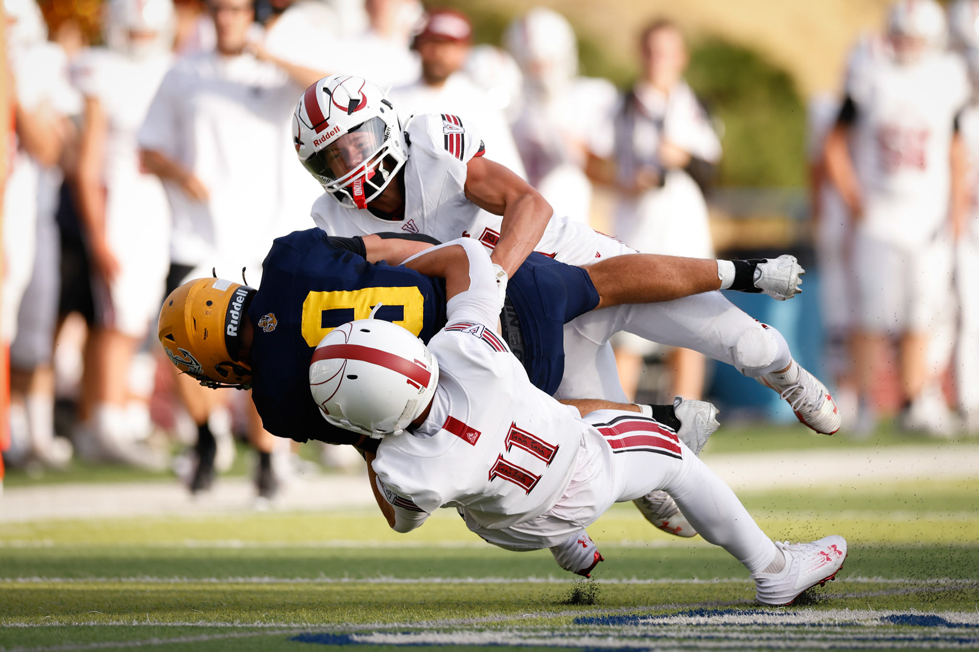 Viewmont CB Brady Clegg (11) wraps up Bonneville WR Daniel Park (8) early in the first quarter of the season.