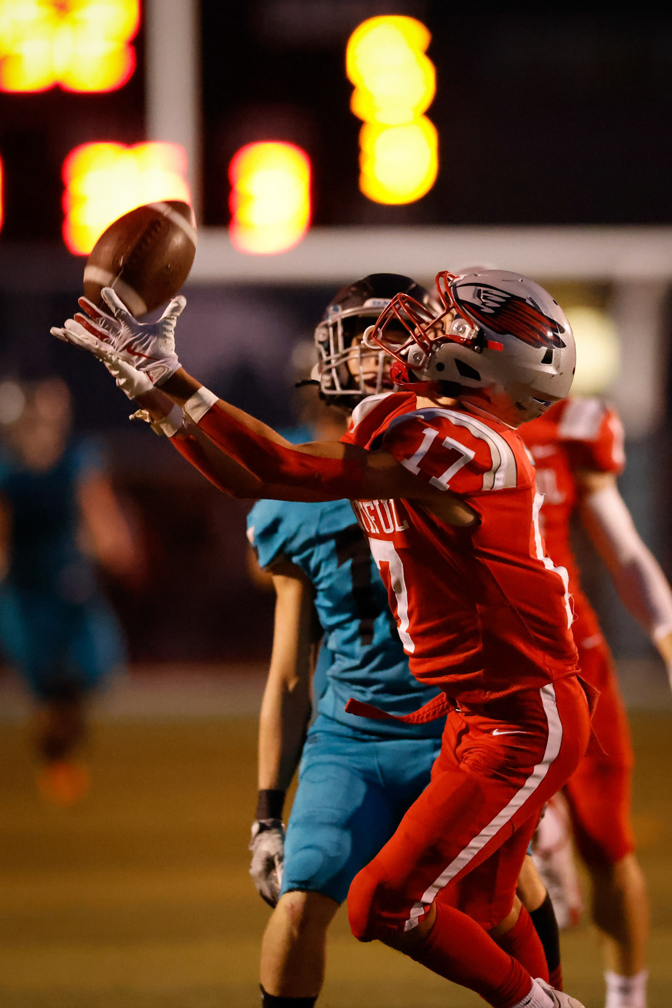 Bountiful WR Max Feller (17) catches a long pass setting up a last minute touchdown for the Redhawks.