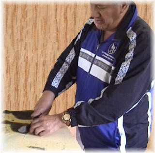 John Mahara cutting head off flounder.