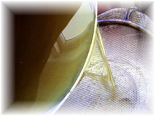 Strain the liquid into a jug for pouring.