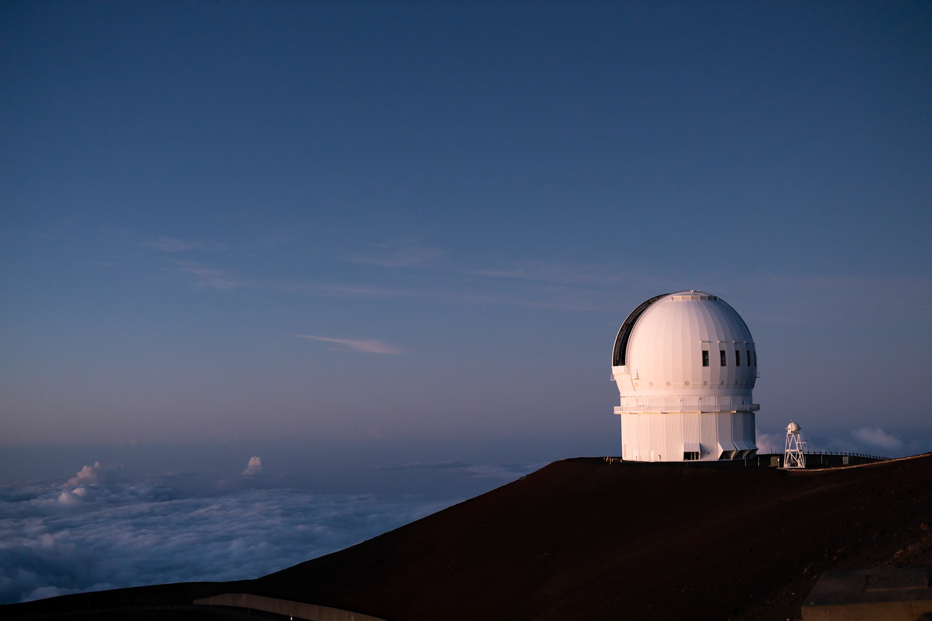 When the night falls in, huge telescopes of Mount Mauna Kea, focus their lenses to better understand our origin by reading star trails. HI, United States of America.