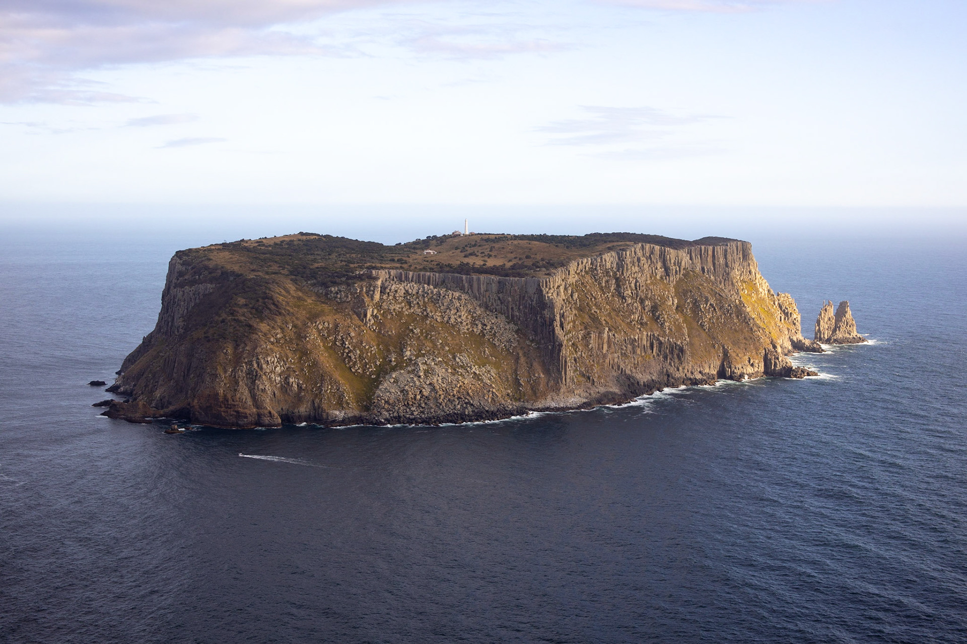 A particular cliffed island standing out, isolated, in one of the roughest seas in the World, TAS, Australia.