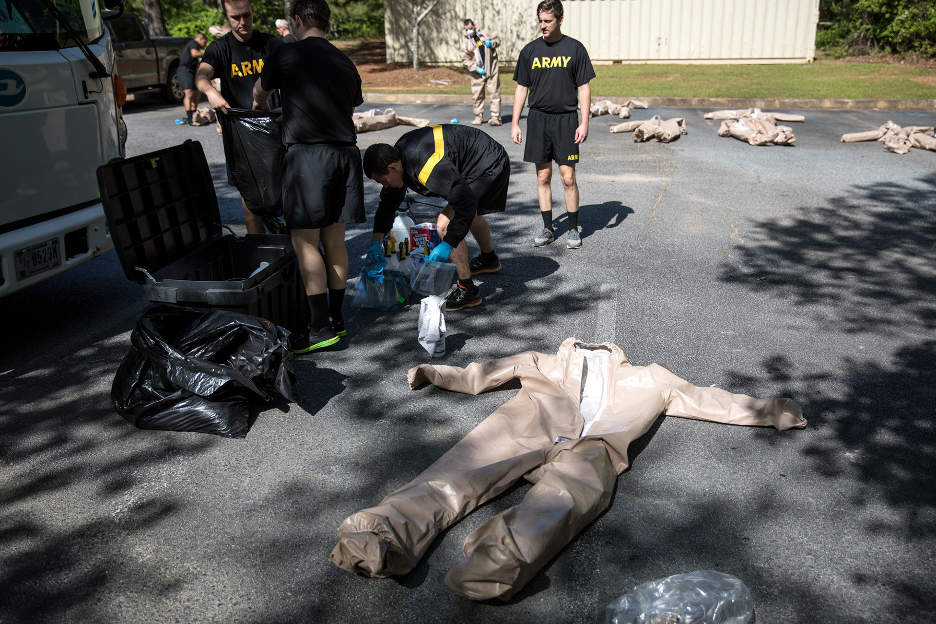 Georgia National Guardsmen wear full infection control gear and wield disinfecting spray as they clean the Condor Health Lafayette nursing home in Fayetteville on April 22.