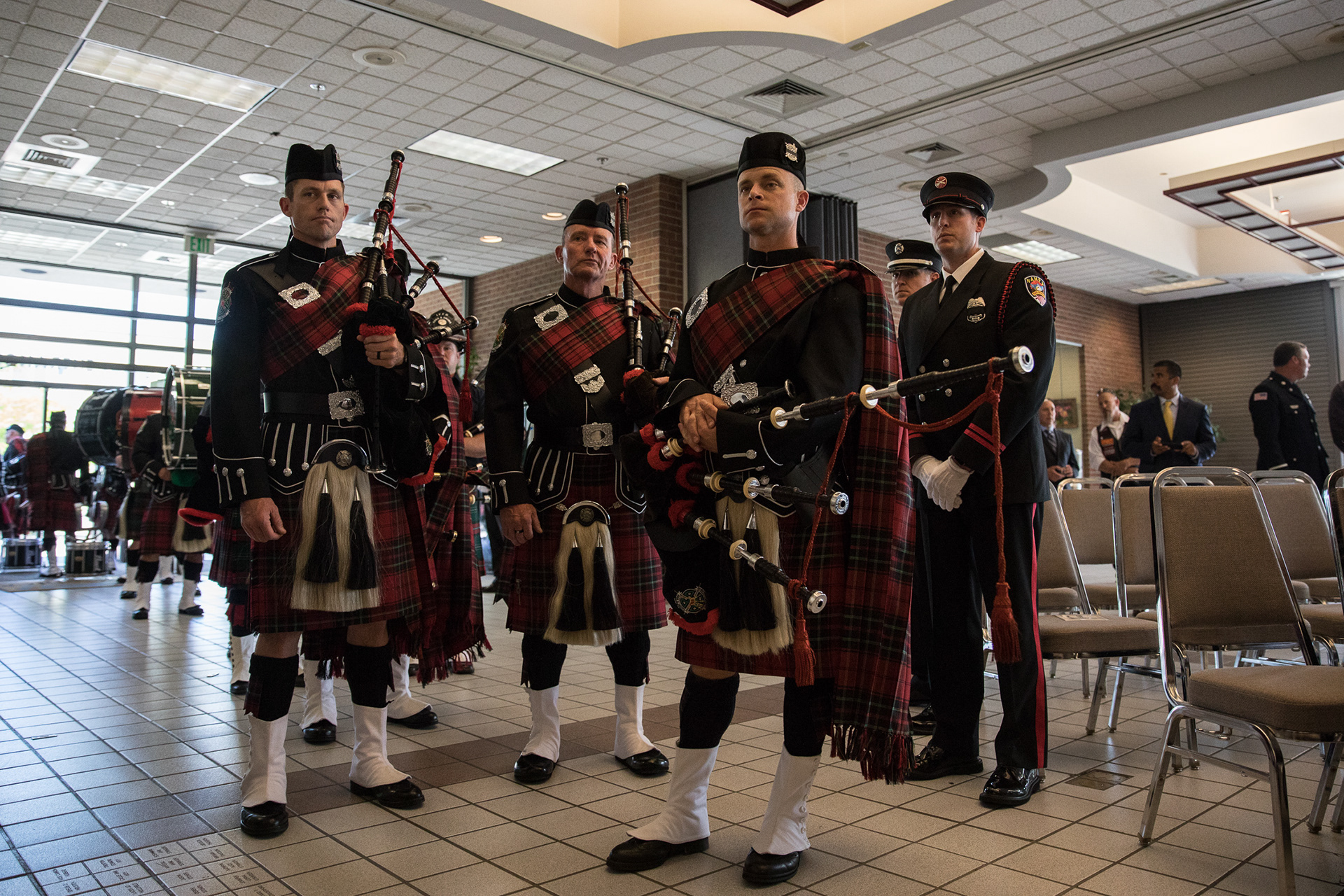A pipe band stands Saturday in the Nampa Civic Center at a memorial service for Boise Senior Firefighter Charlie Ruffing on May 31.