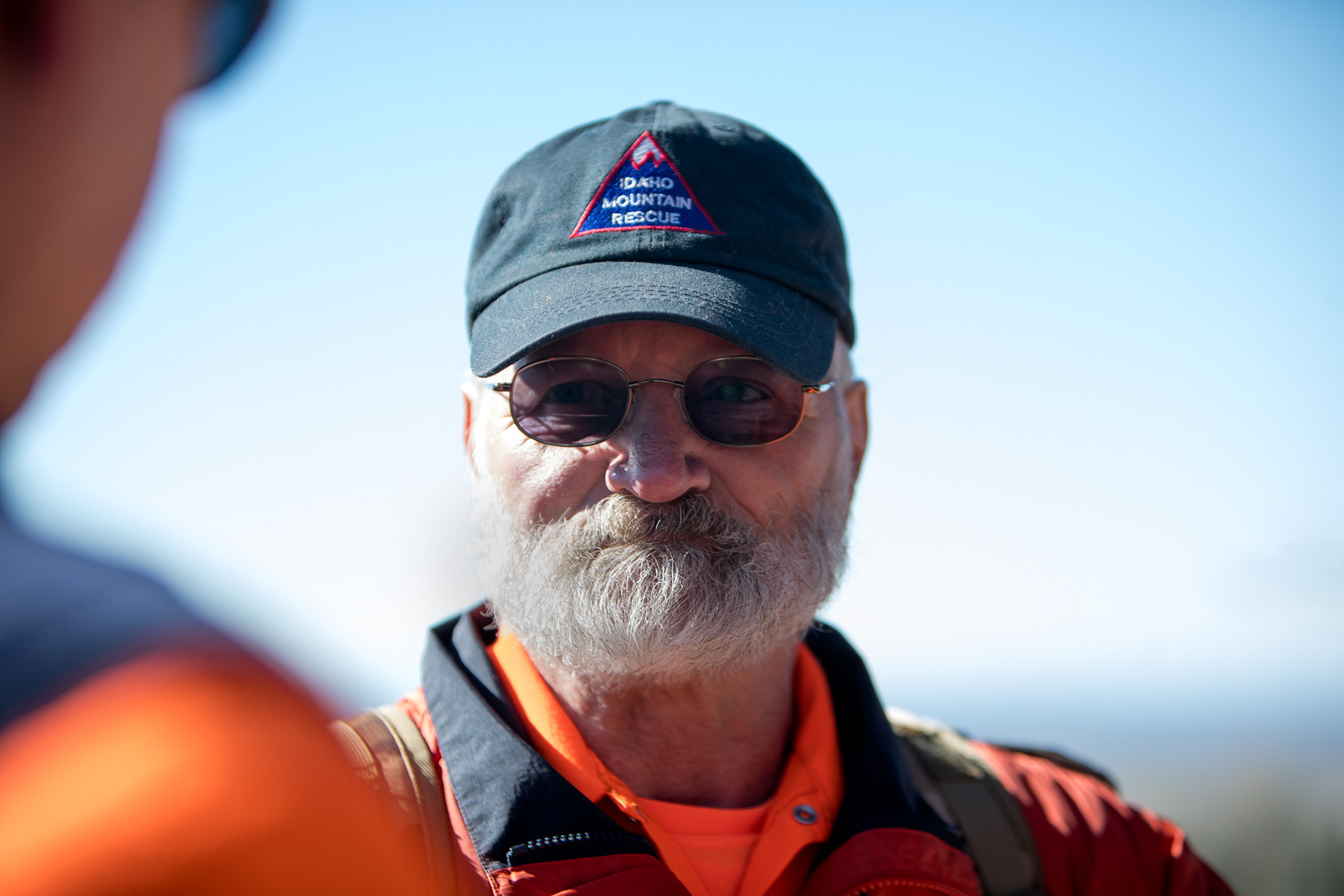 Unit member Michael Rock answers questions from other members playing the role of "spontaneous volunteers" during a field training on March 16 at Bonneville Point just outside of Boise.