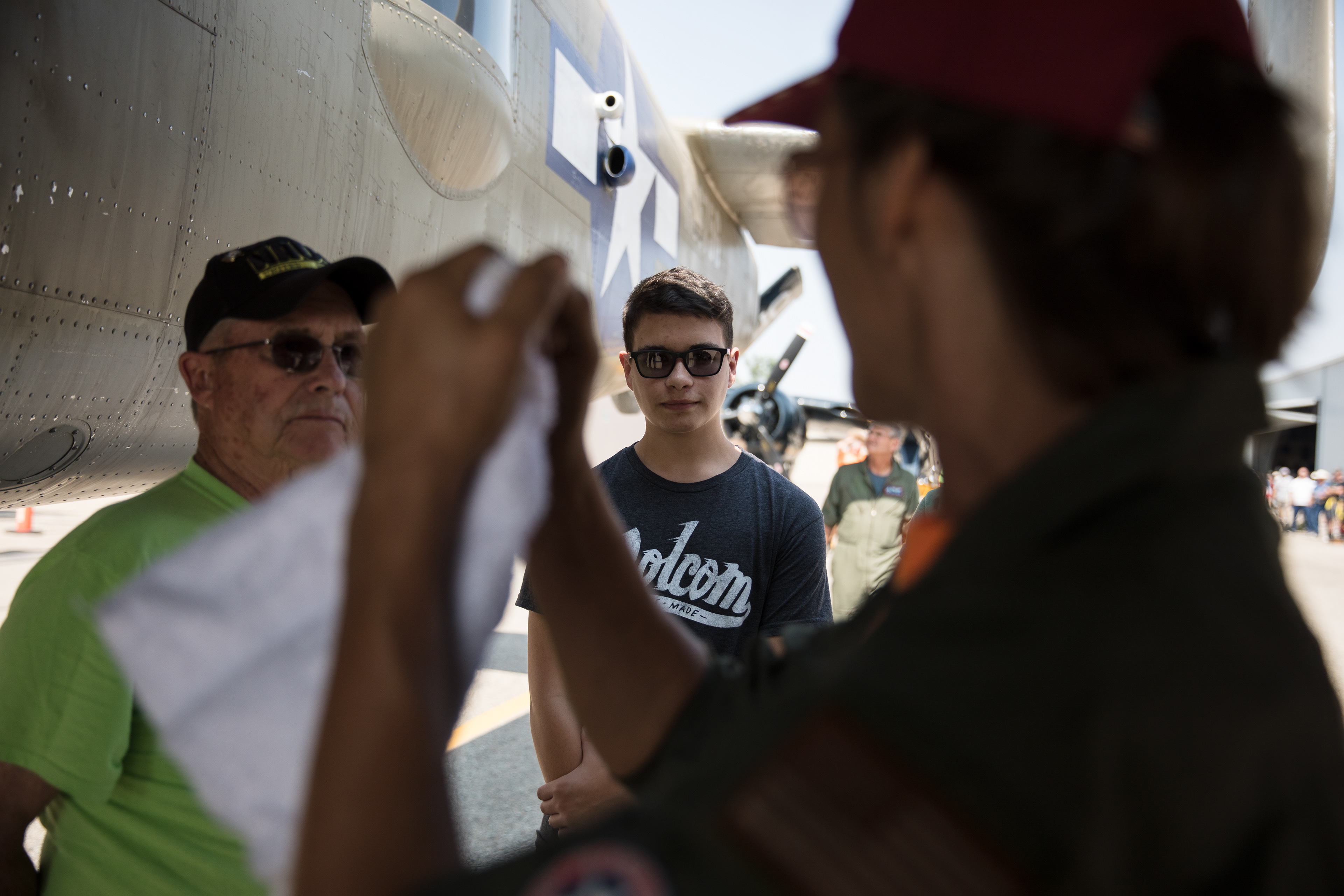 The flight engineer gives Ethan Nichols last minute instructions before takeoff from the Warhawk Museum in Nampa on Aug 25.