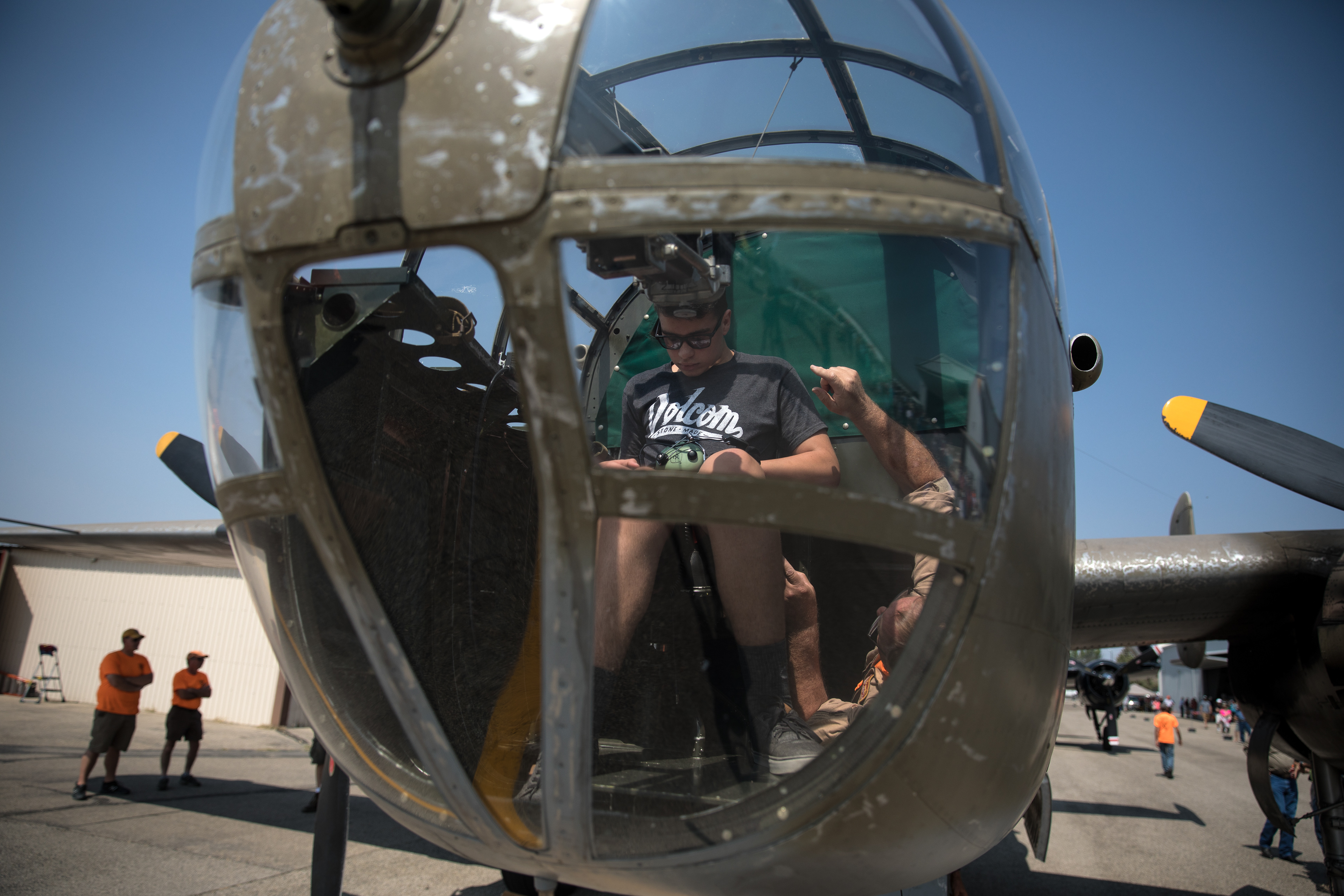 Ethan Nichols, 15, is slowly losing his eyesight to a rare genetic disease. A WWI fanatic, The Warhawk Museum in Nampa invited Ethan to ride in a bomber. A crew member of the North American B-25 Mitchell medium bomber gives Ethan Nichols last minute instructions before their flight at the Warhawk Museum in Nampa on Aug 25.