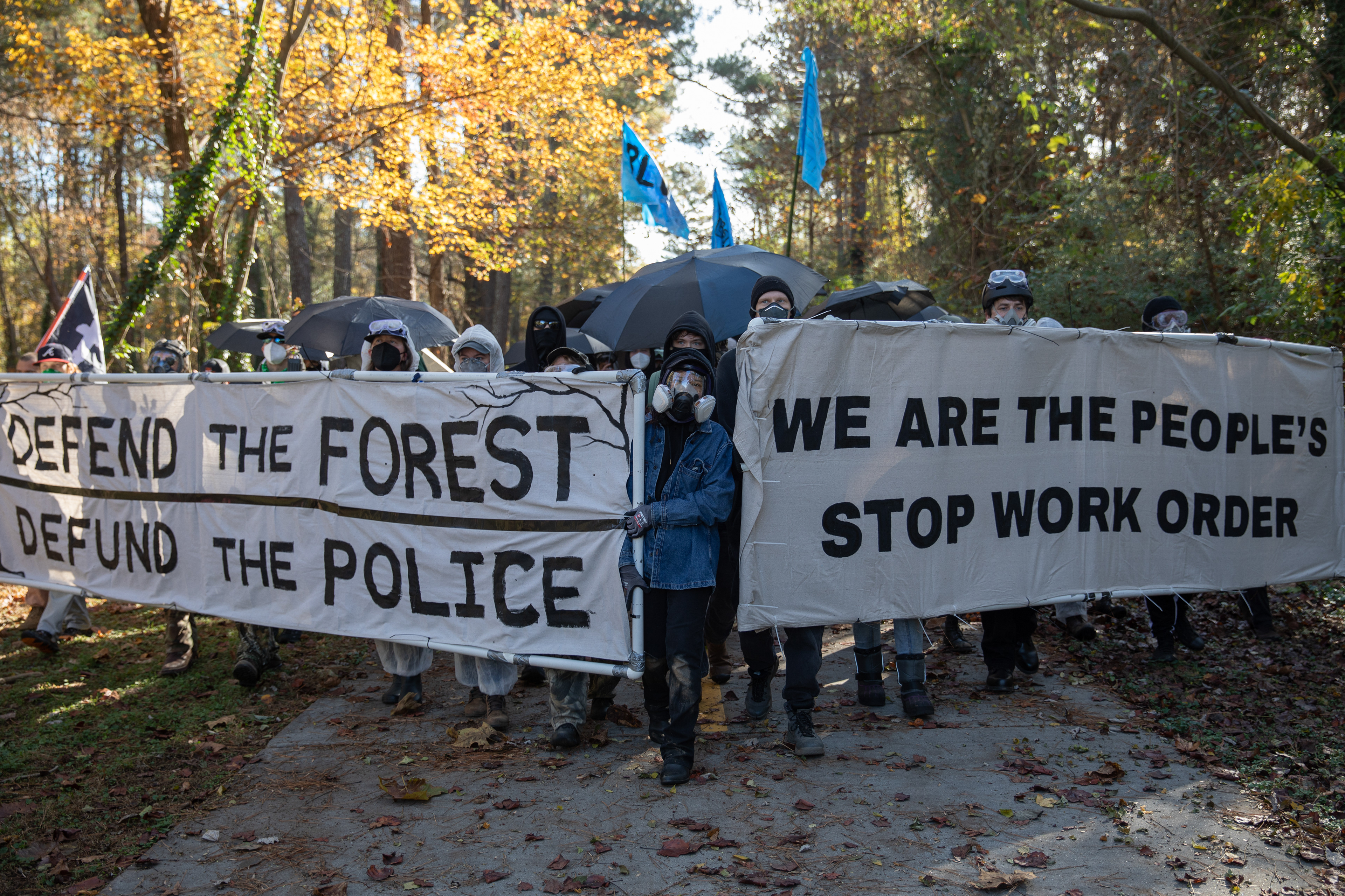 Hundreds of opponents of Atlanta's public safety training center march in protest toward the site.