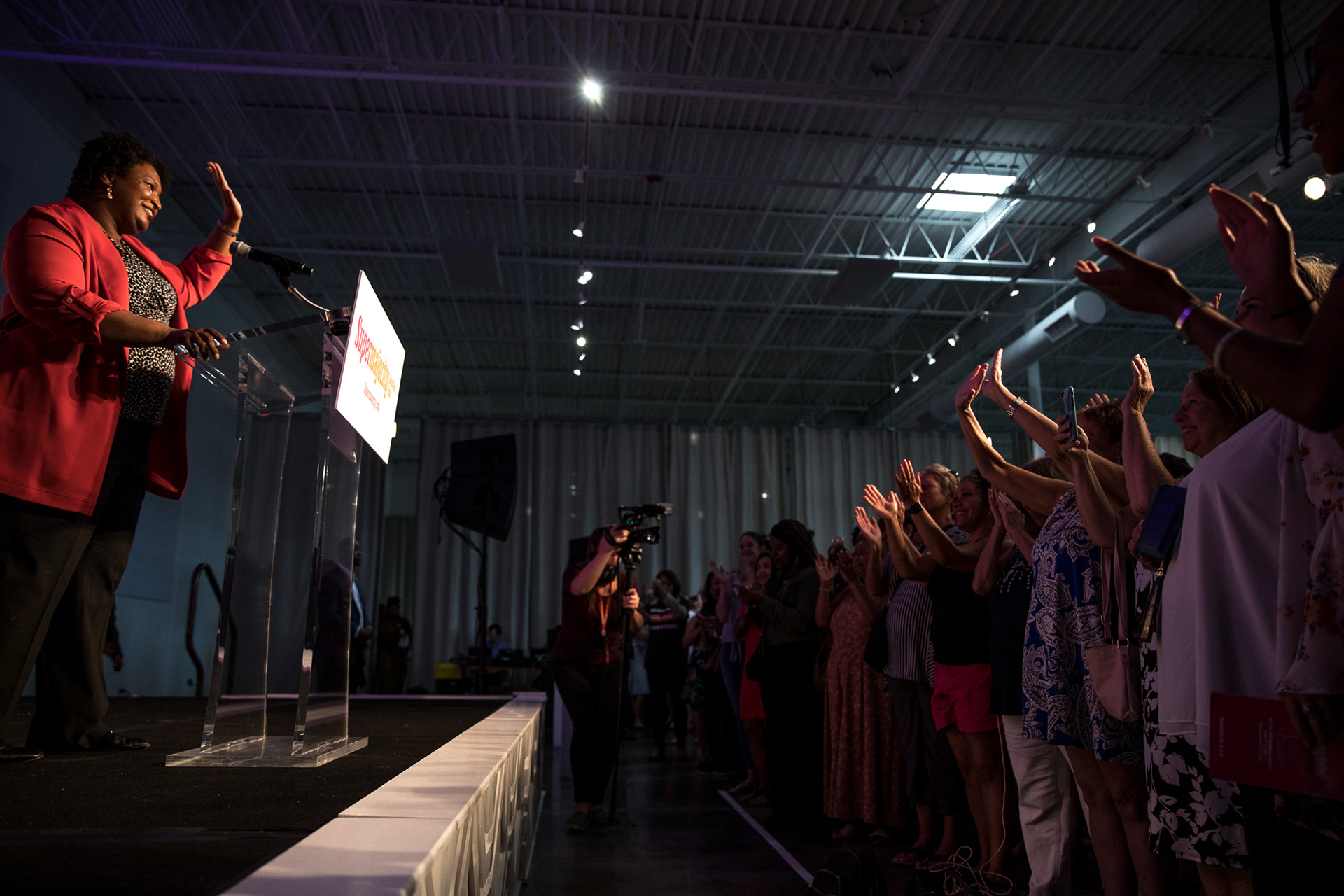 Stacey Abrams waves to the crowd of hundreds at the Supermajority launch event in Atlanta on Sept. 15.