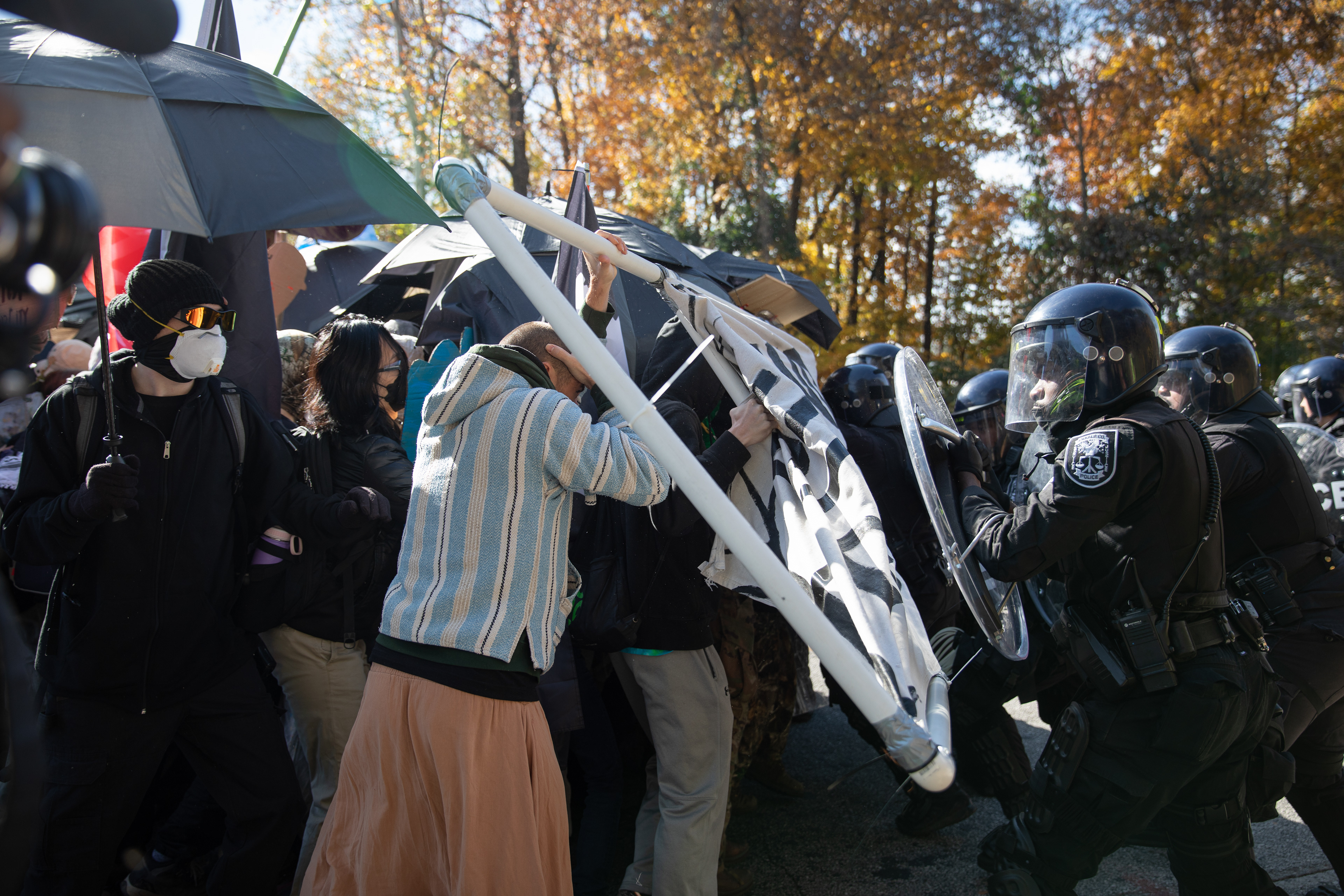 Protesters against Atlanta's public safety training center clash with police less than a mile away from the site,