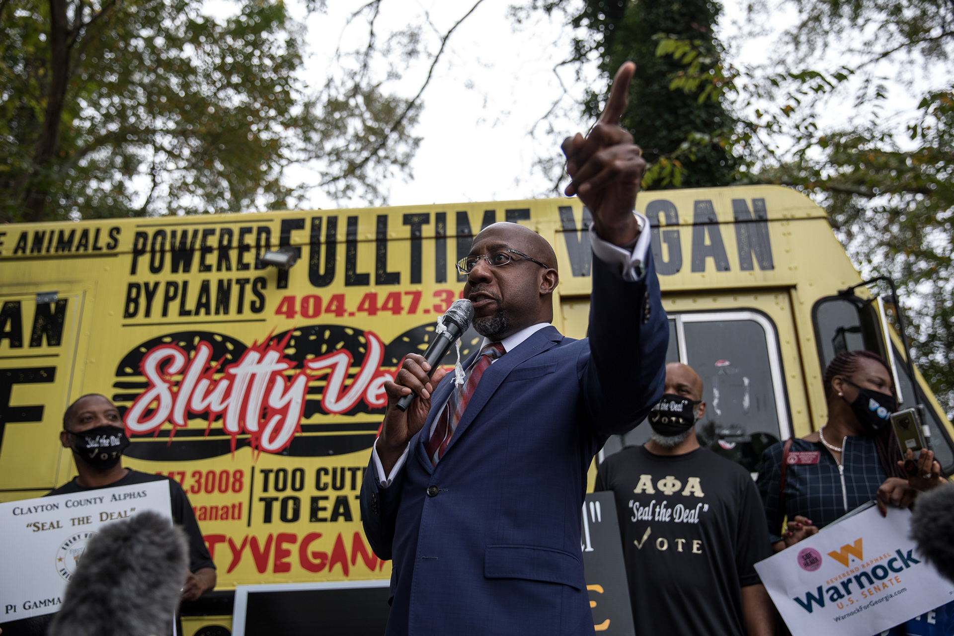 Democratic Senate candidates Jon Ossoff and Rev. Raphael Warnock rally in Jonesboro with rapper Common on Oct. 27.
