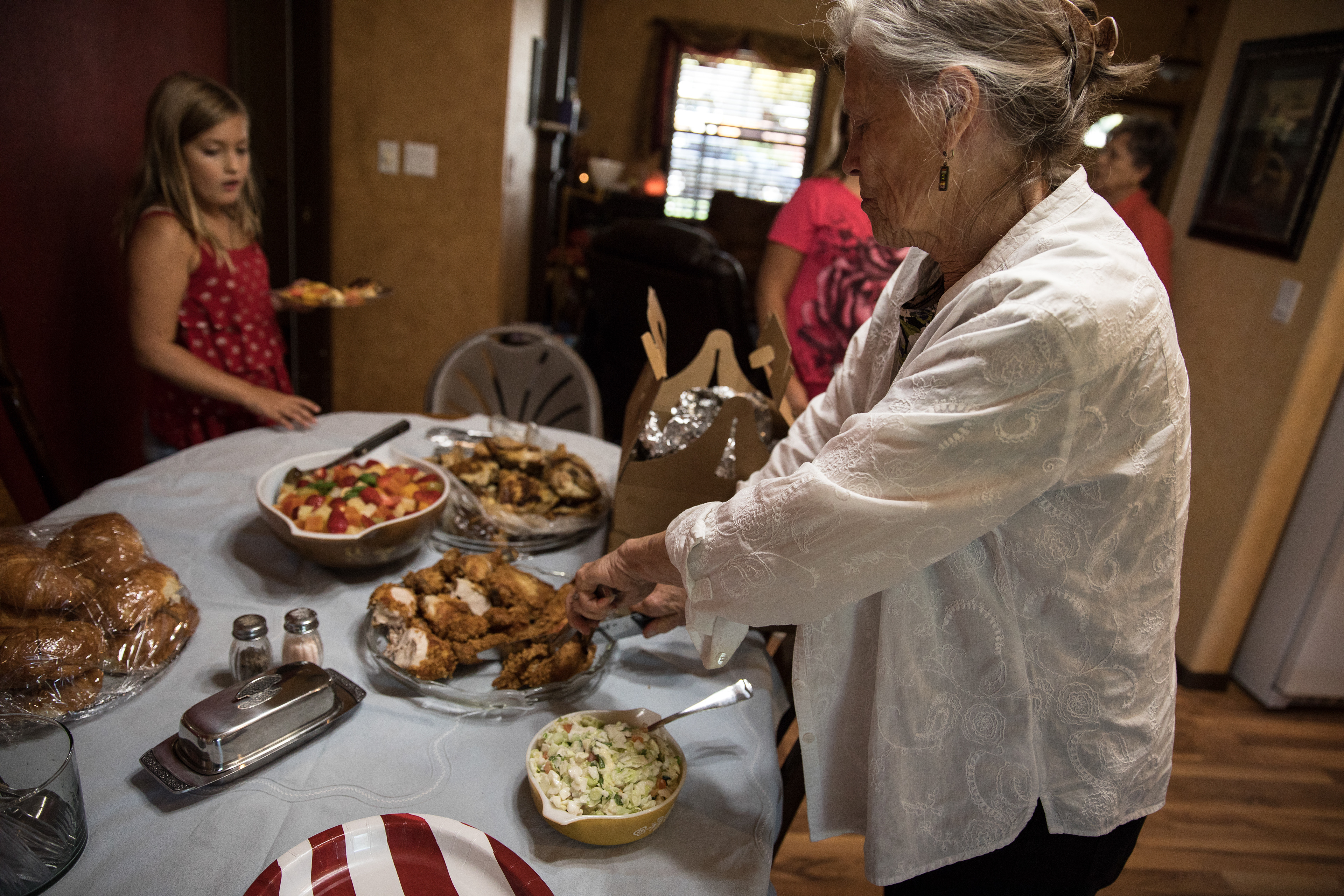 Pauline Nielson prepares lunch for friends and family at a WWII veteran reunion on Sept. 14 in Nampa.