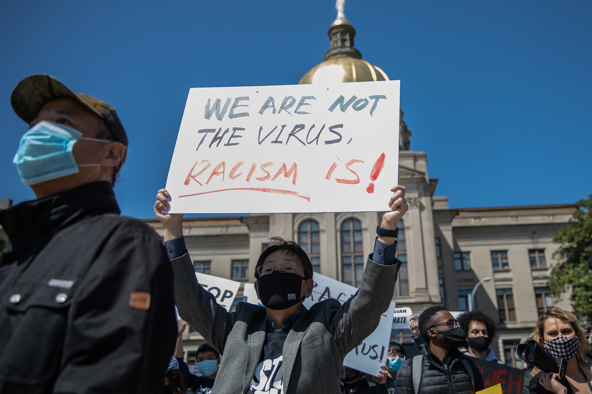Georgia's Asian American and Pacific Islander community gather at the Georgia State Capitol to mourn the victims of the Atlanta shooting and protest racism against the community.