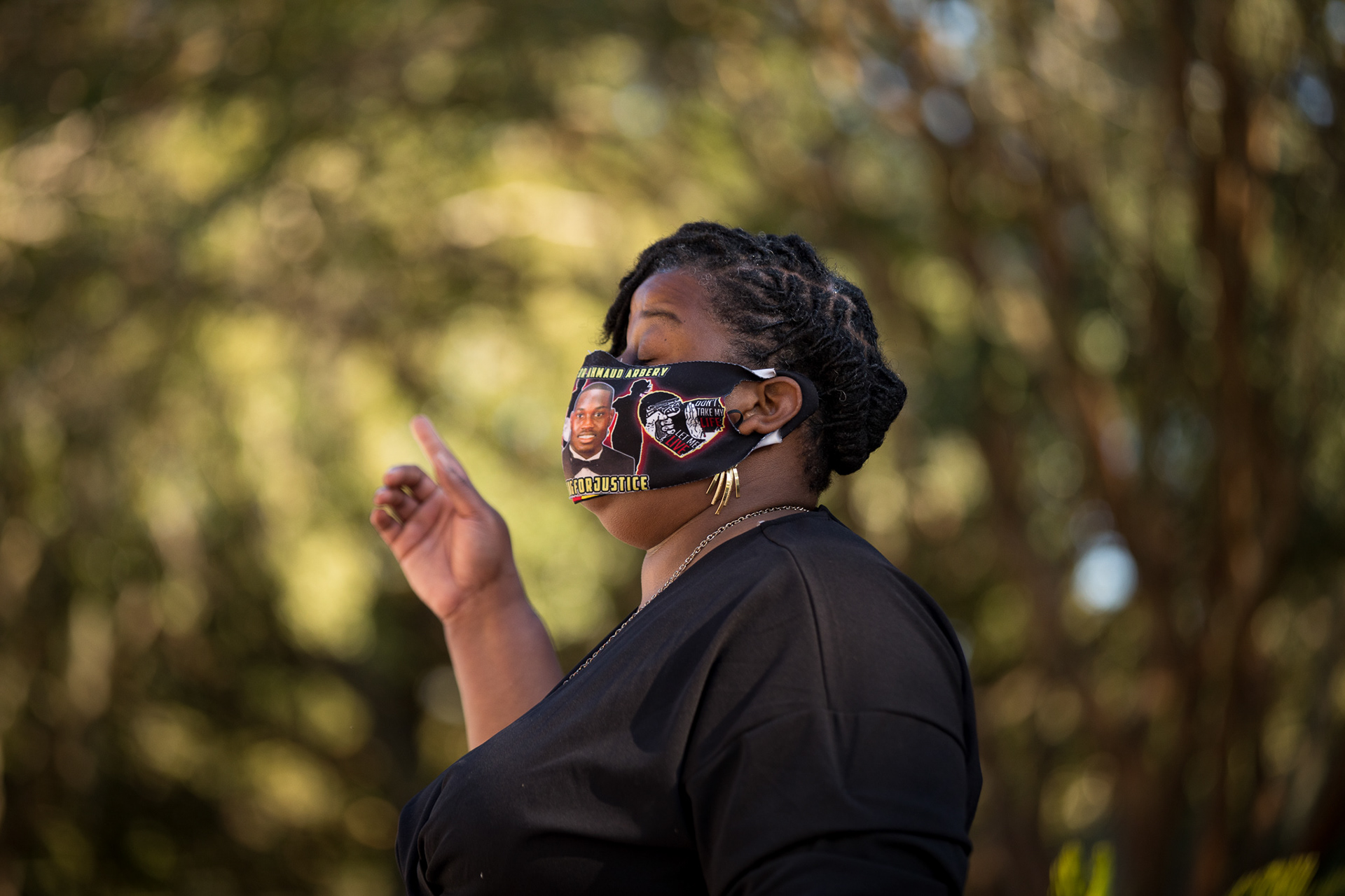 Ahmaud Arbery’s aunt Theawanza Brooks prays outside of the Glynn County Courthouse in Brunswick on Oct. 17, 2021, during a vigil to honor Arbery ahead of the trial of the three white men charged in his killing.