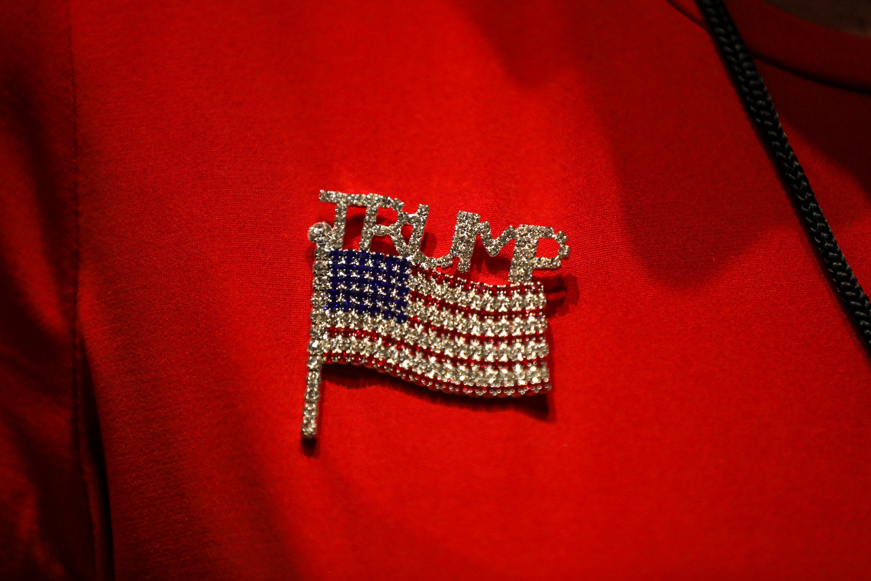 A Trump Victory rally attendee accessorizes with an American flag pin at an event aimed at winning over Black voters in Atlanta on Sept. 25. 