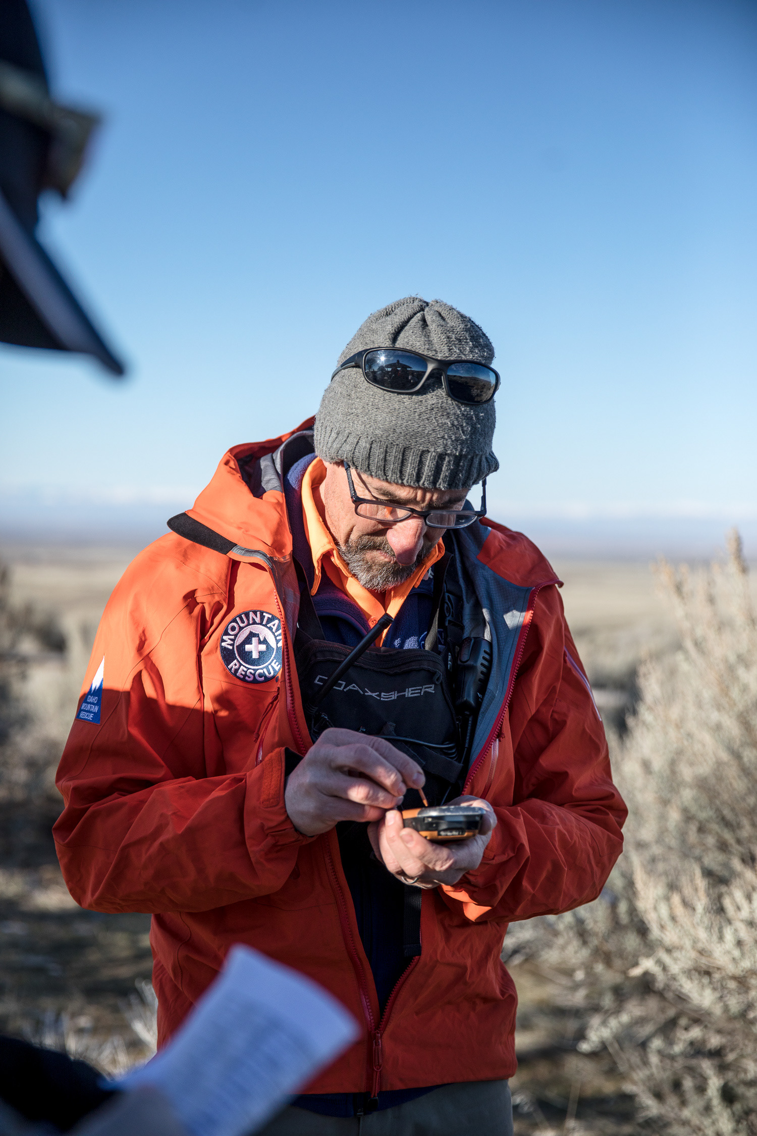 Gregg Rettschlag, decade-long unit member and current president, inputs coordinates into a GPS system during a field training on March 16 at Bonneville Point just outside of Boise.