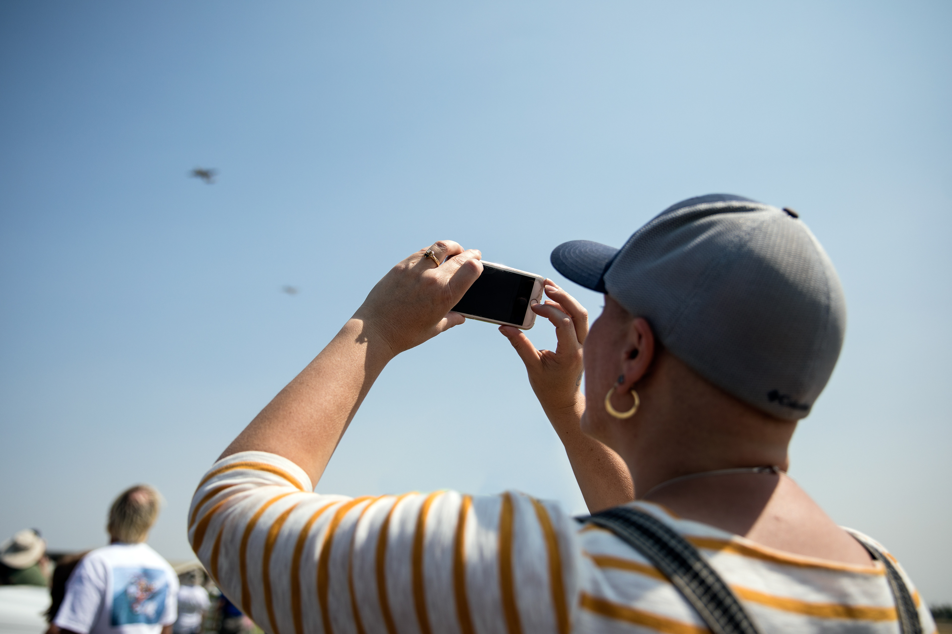 Laura Nichols snaps a picture of the North American B-25 Mitchell medium bomber carrying her son Ethan Nichols, 15, and daughter Abby Nichols, 17, at the Warhawk Museum in Nampa on Aug 25.