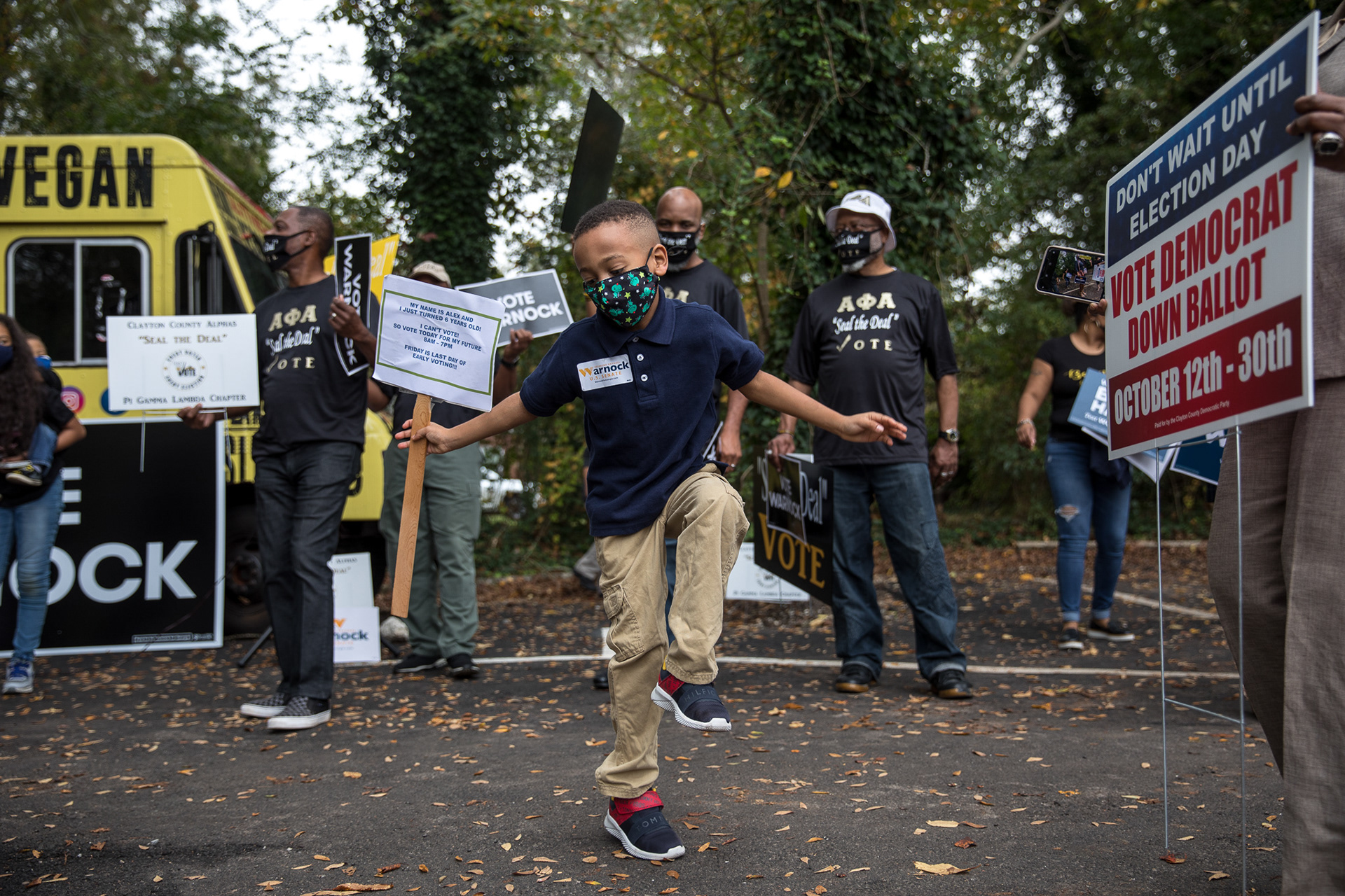 Democratic Senate candidates Jon Ossoff and Rev. Raphael Warnock rally in Jonesboro with rapper Common on Oct. 27.