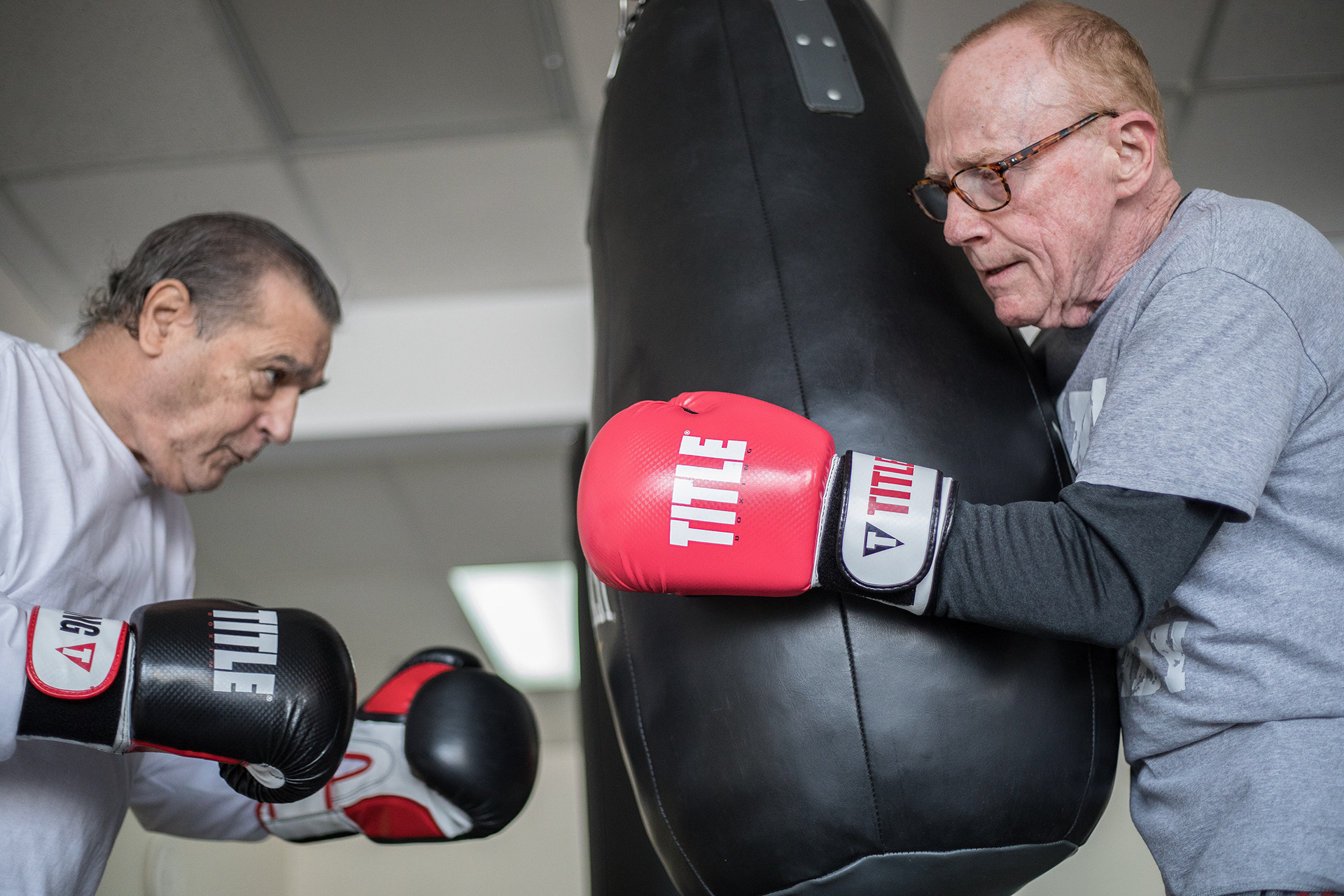 Rock Steady Boxing, a small space nestled within a strip mall on Oswego Street, is a sanctuary where Parkinson’s is a reality for everyone.