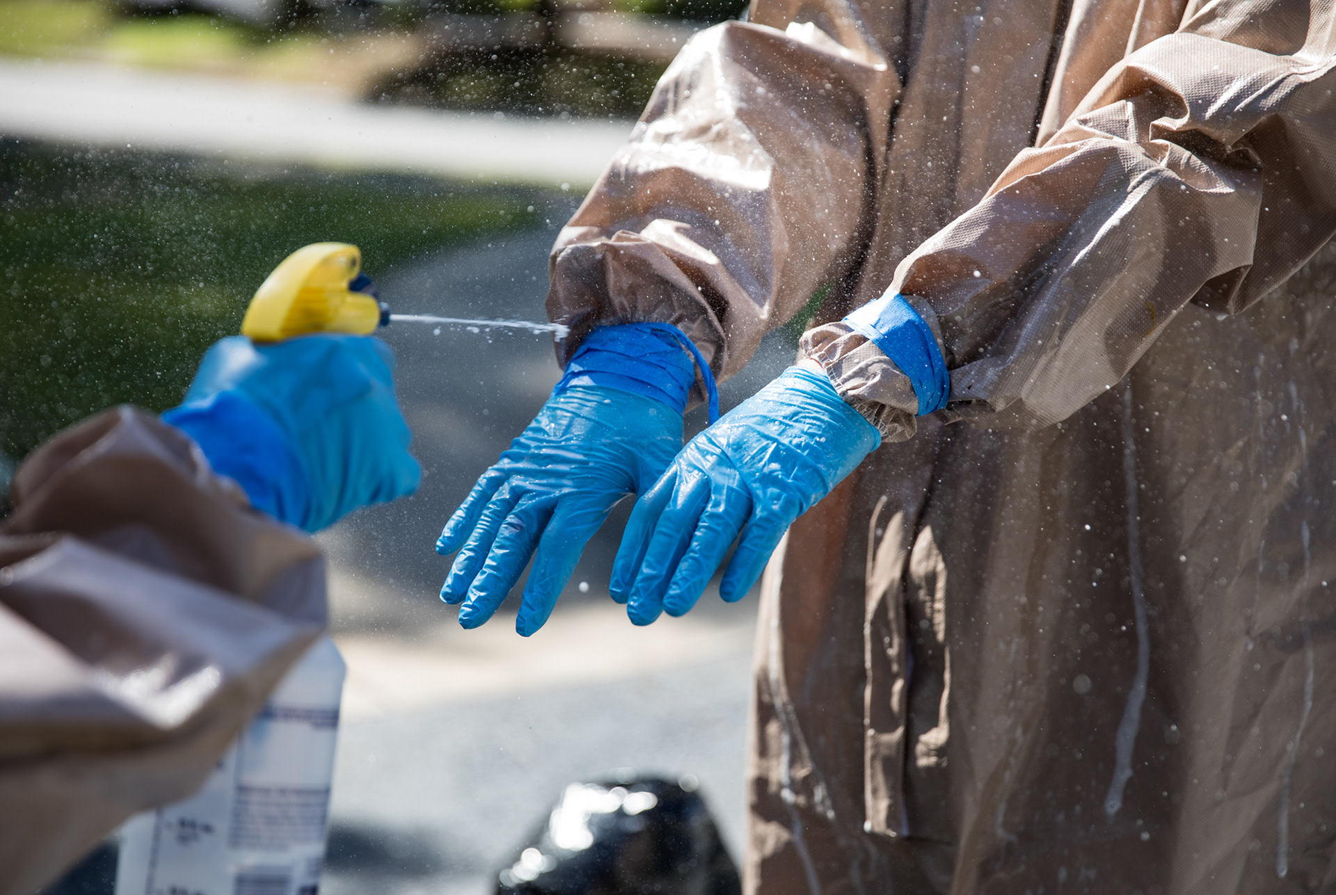 Georgia National Guardsmen wear full infection control gear and wield disinfecting spray as they clean the Condor Health Lafayette nursing home in Fayetteville on April 22.